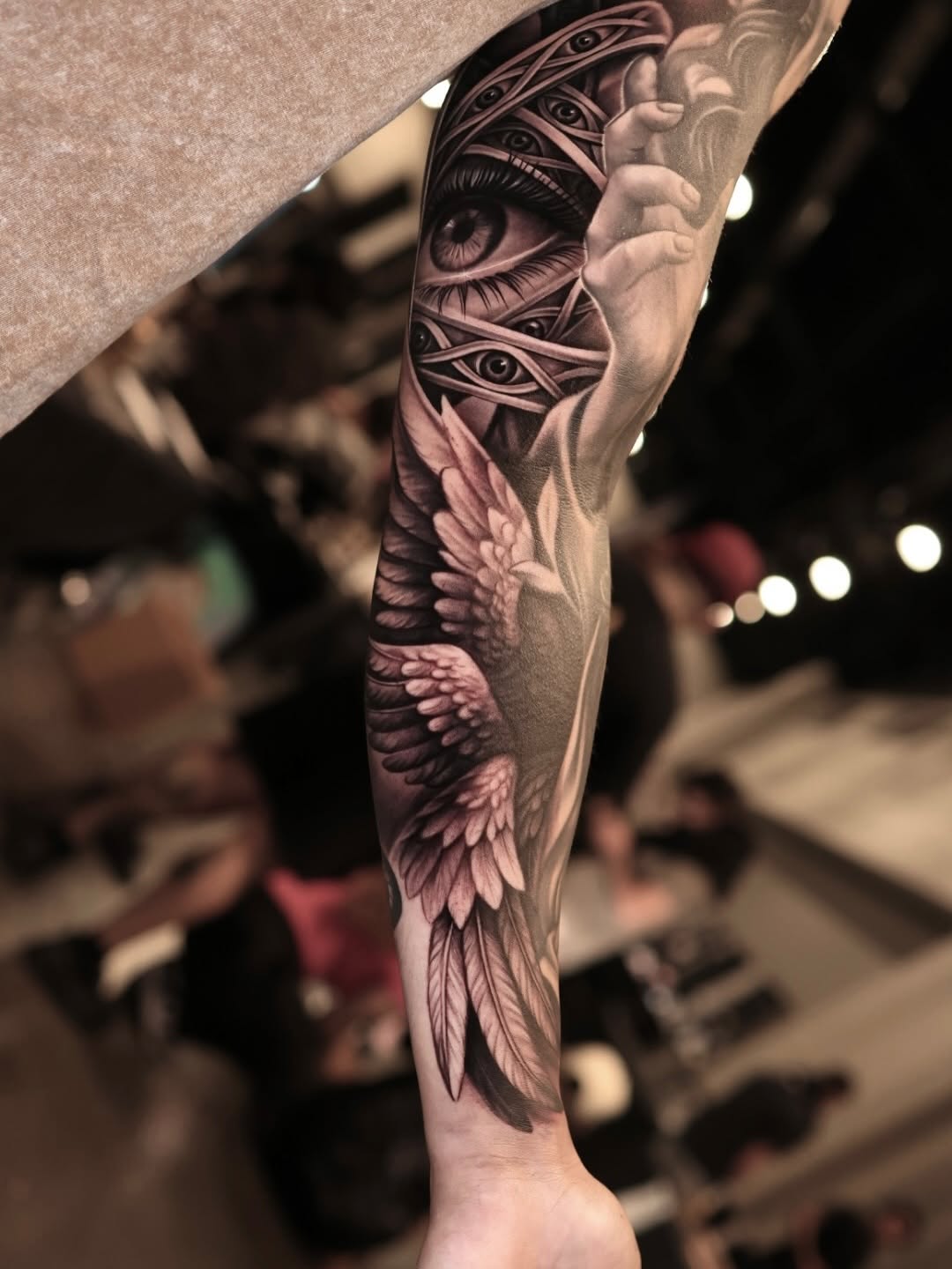 Eye and wings realism tattoo on the forearm by Steven Villegas�