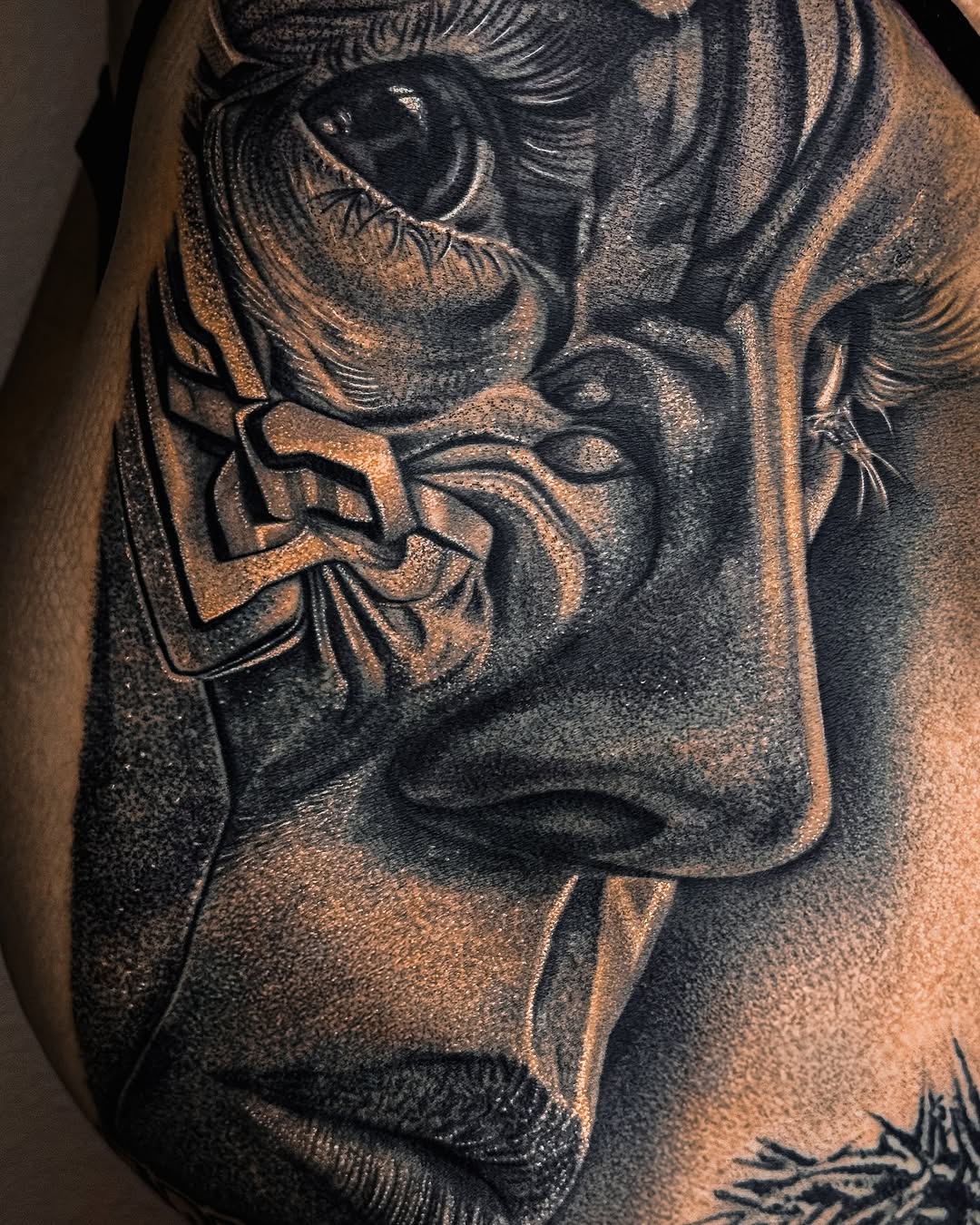 Face with geometric elements realism tattoo on the shoulder by Mak$ Brand