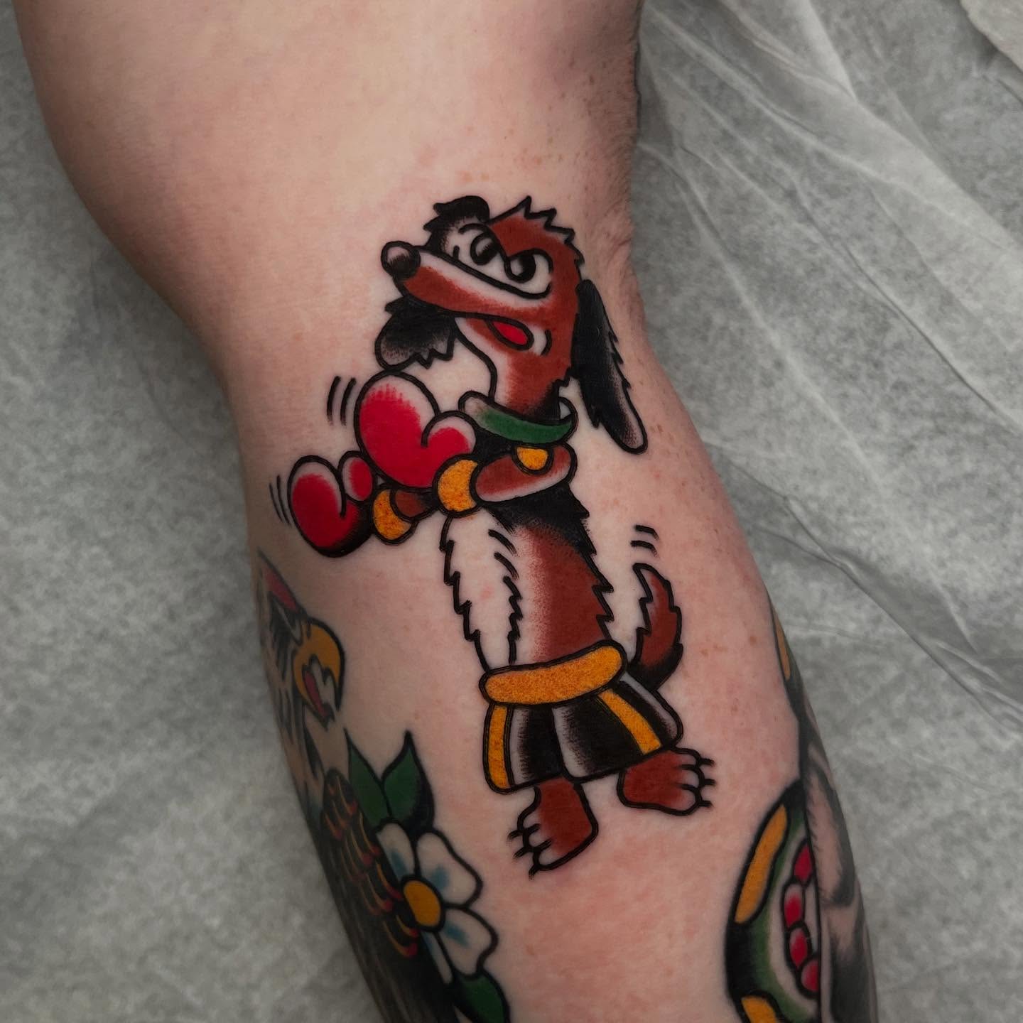 Goofy character American traditional tattoo on the forearm by Rizzo