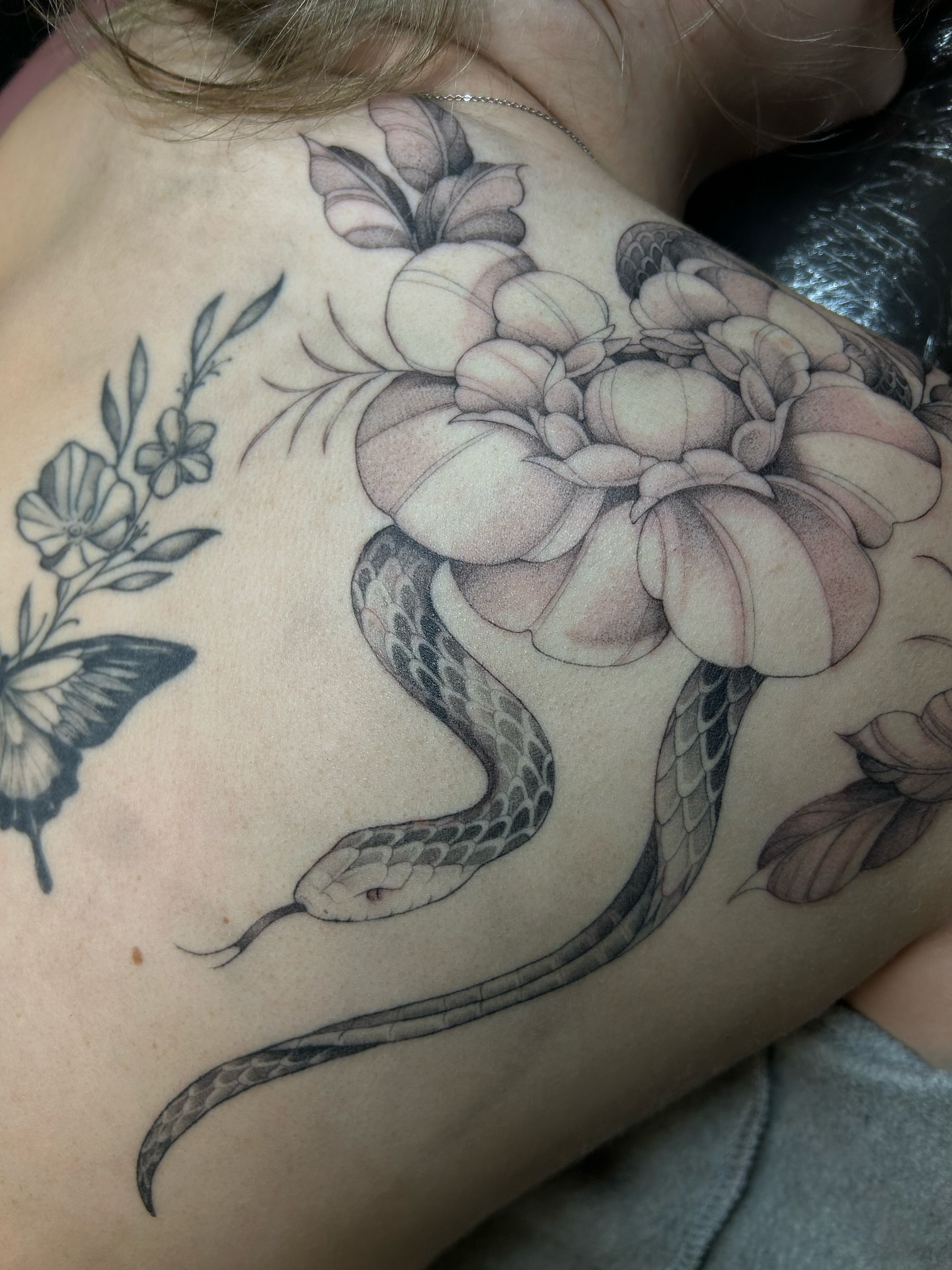 Snake and peony realism tattoo on the shoulder by alyssa jade ⭐️