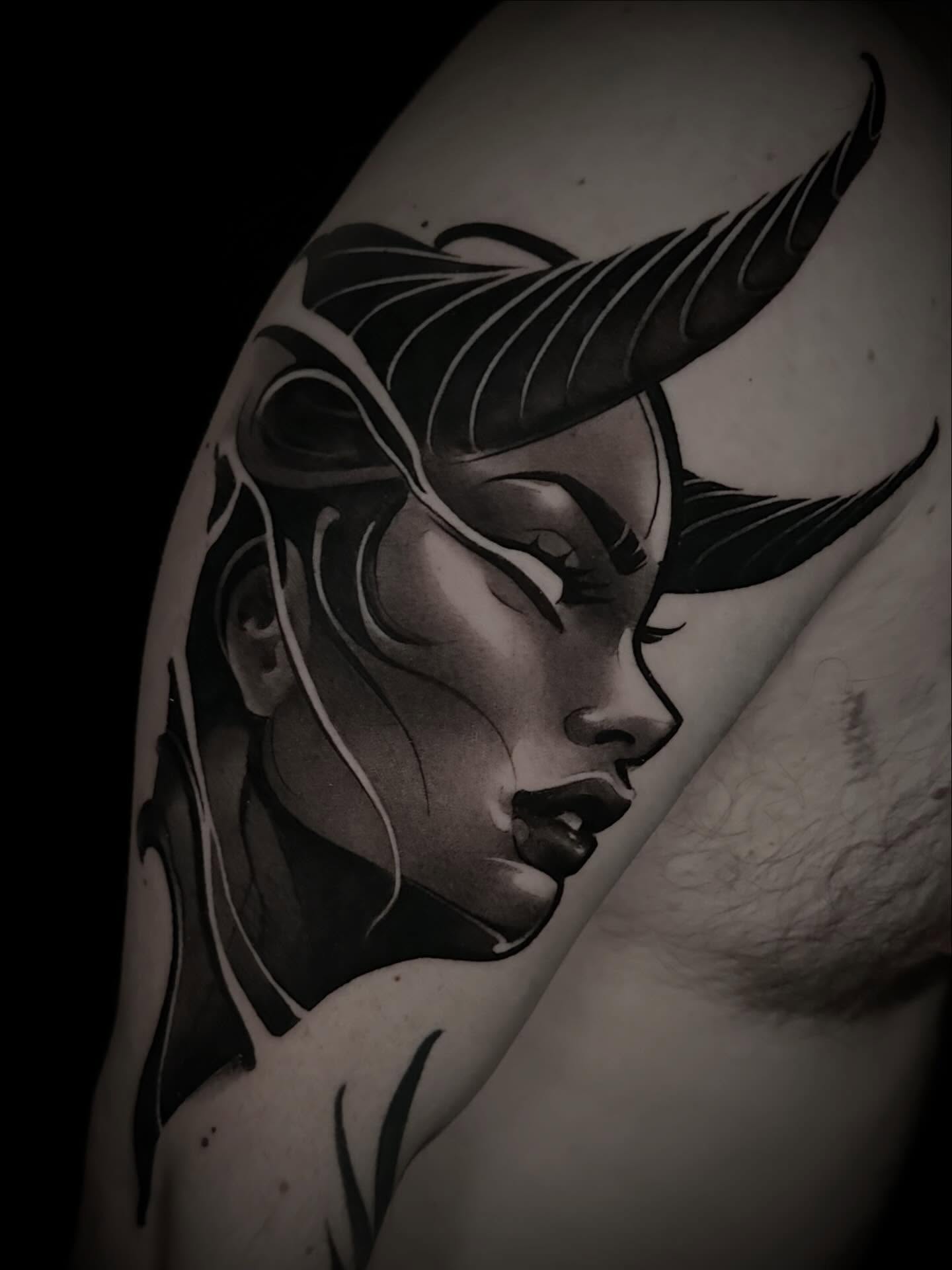 Woman's face realism tattoo on the shoulder by Nathan Adsit