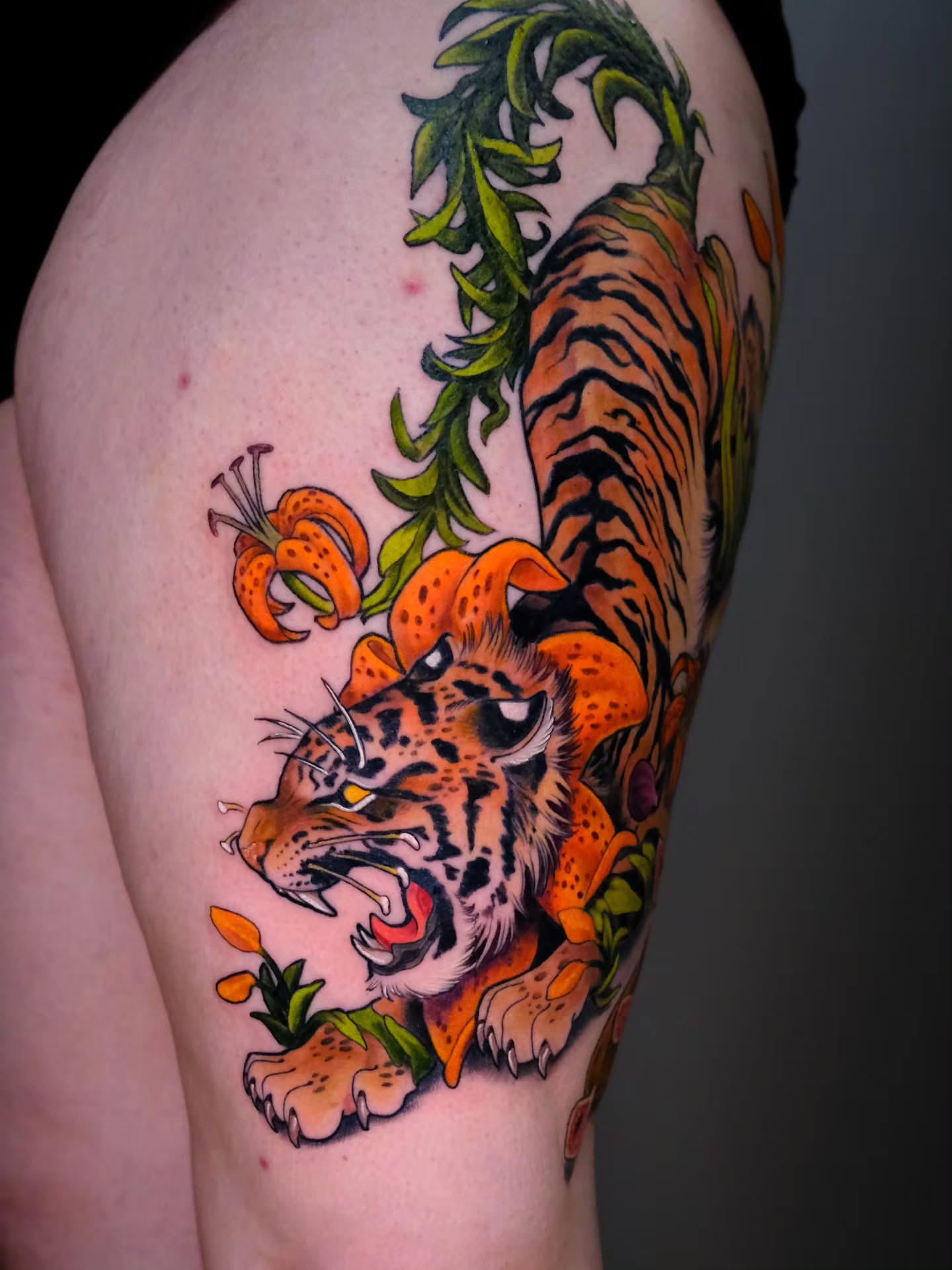 Tiger and tiger lilies new school tattoo on the thigh by Tash  - Seattle Tattoo Artist