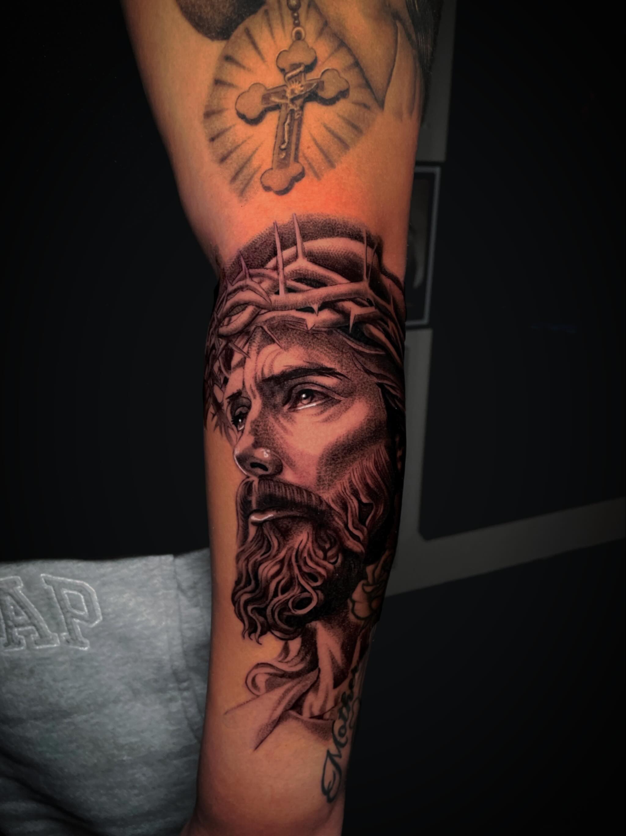 Jesus Christ realism tattoo on the forearm by Chato