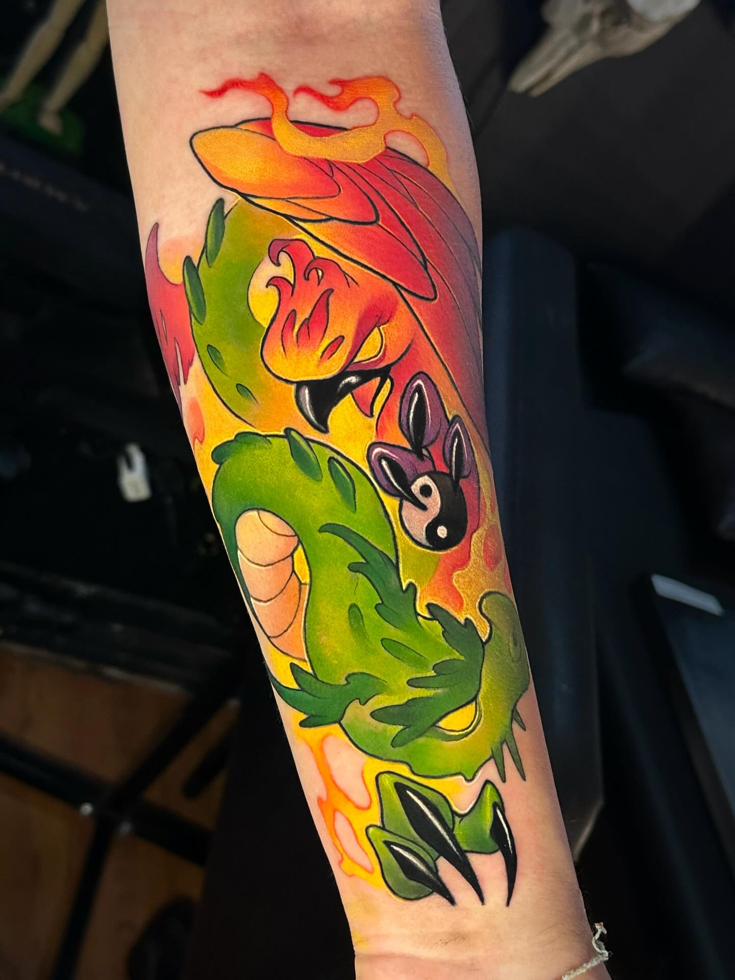 Dragon and rabbit new school tattoo on the forearm by Lena Aleksandrova