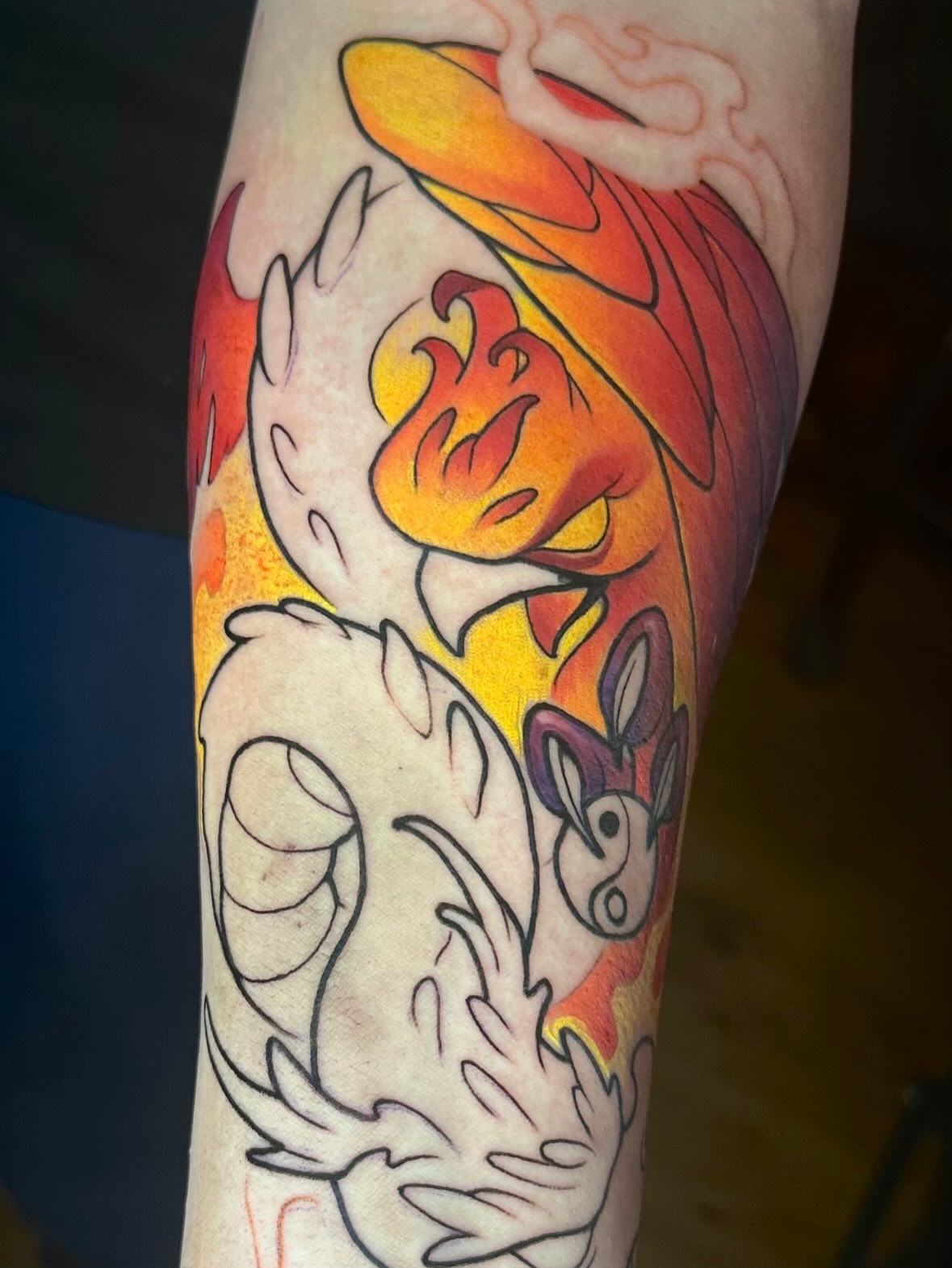 Firebird American traditional tattoo on the forearm by Lena Aleksandrova