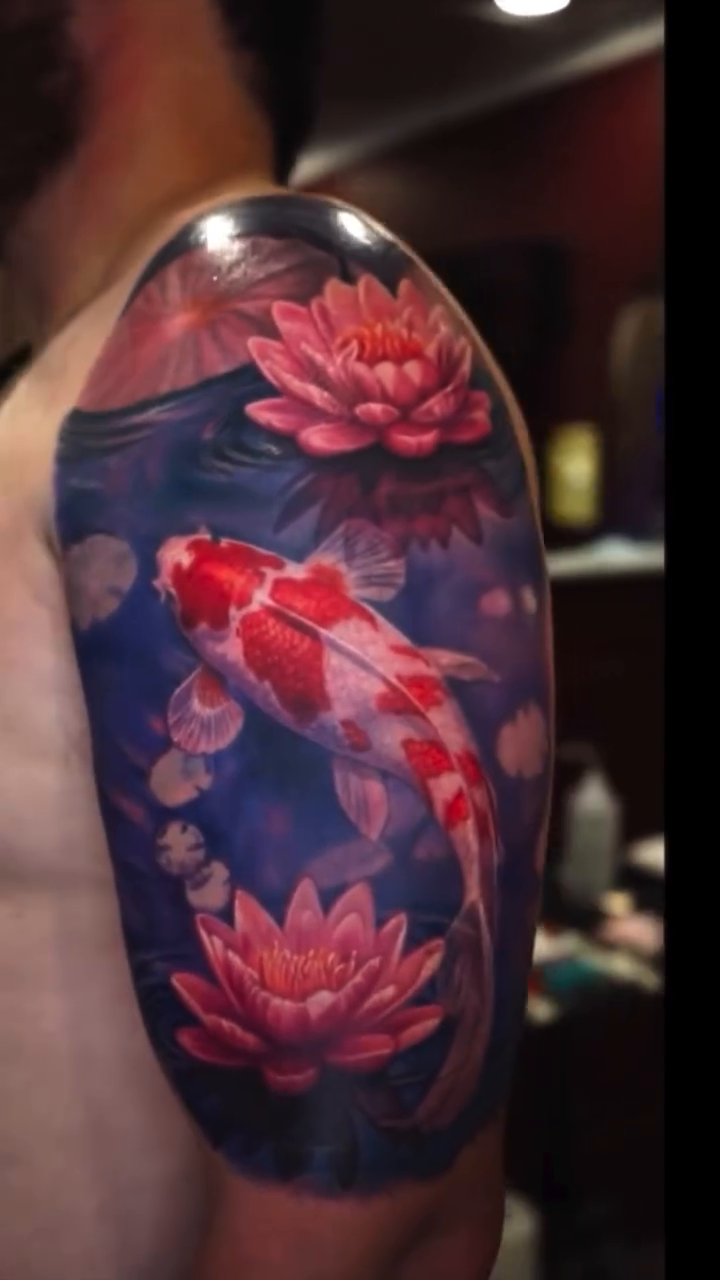 Koi fish and lotus flowers realism tattoo by Tony Johnson - Tattoo Artist, Huntsville, Alabama