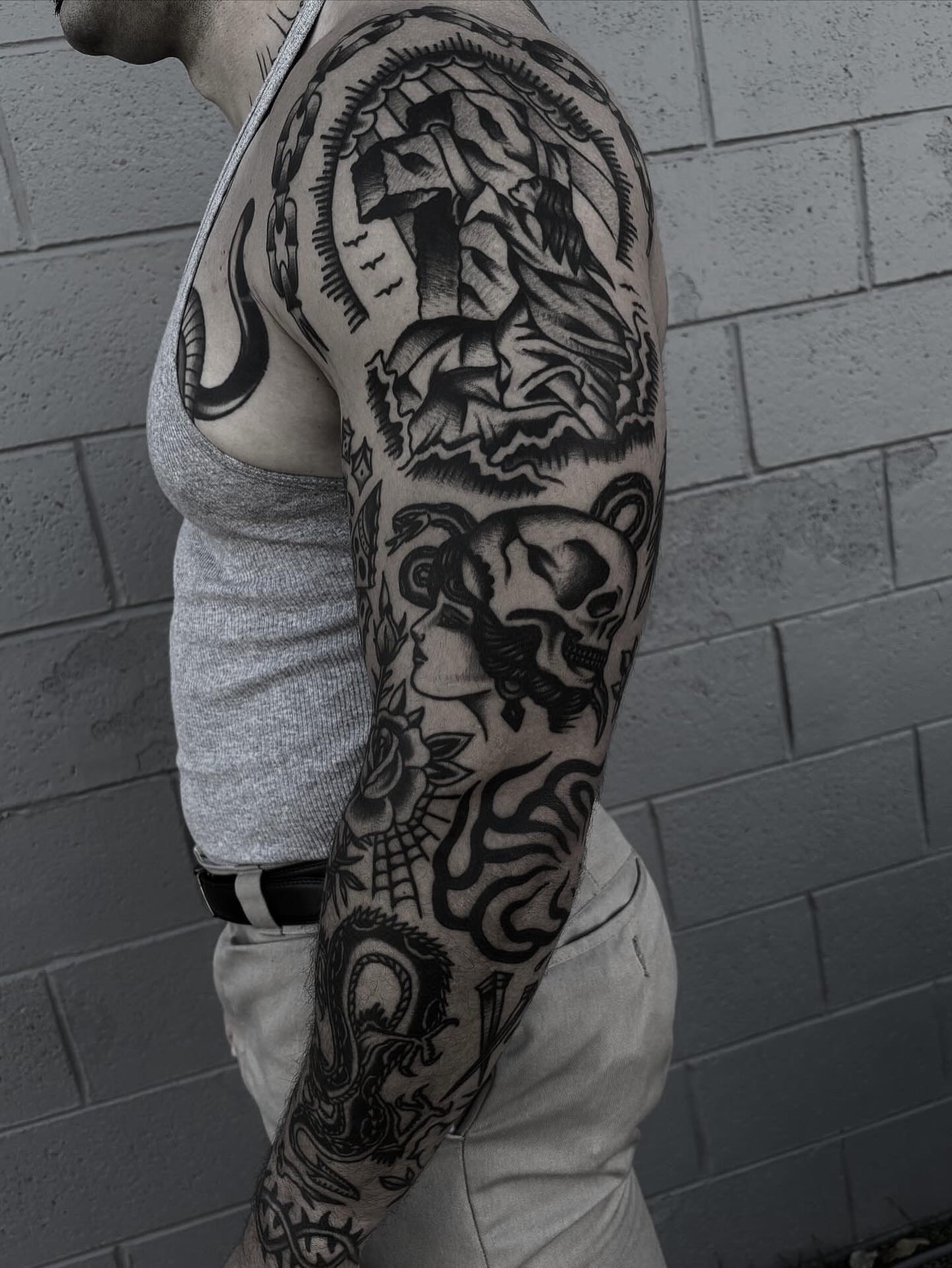 Skull and woman American traditional tattoo on the upper arm by π³πππ πΆπππππ