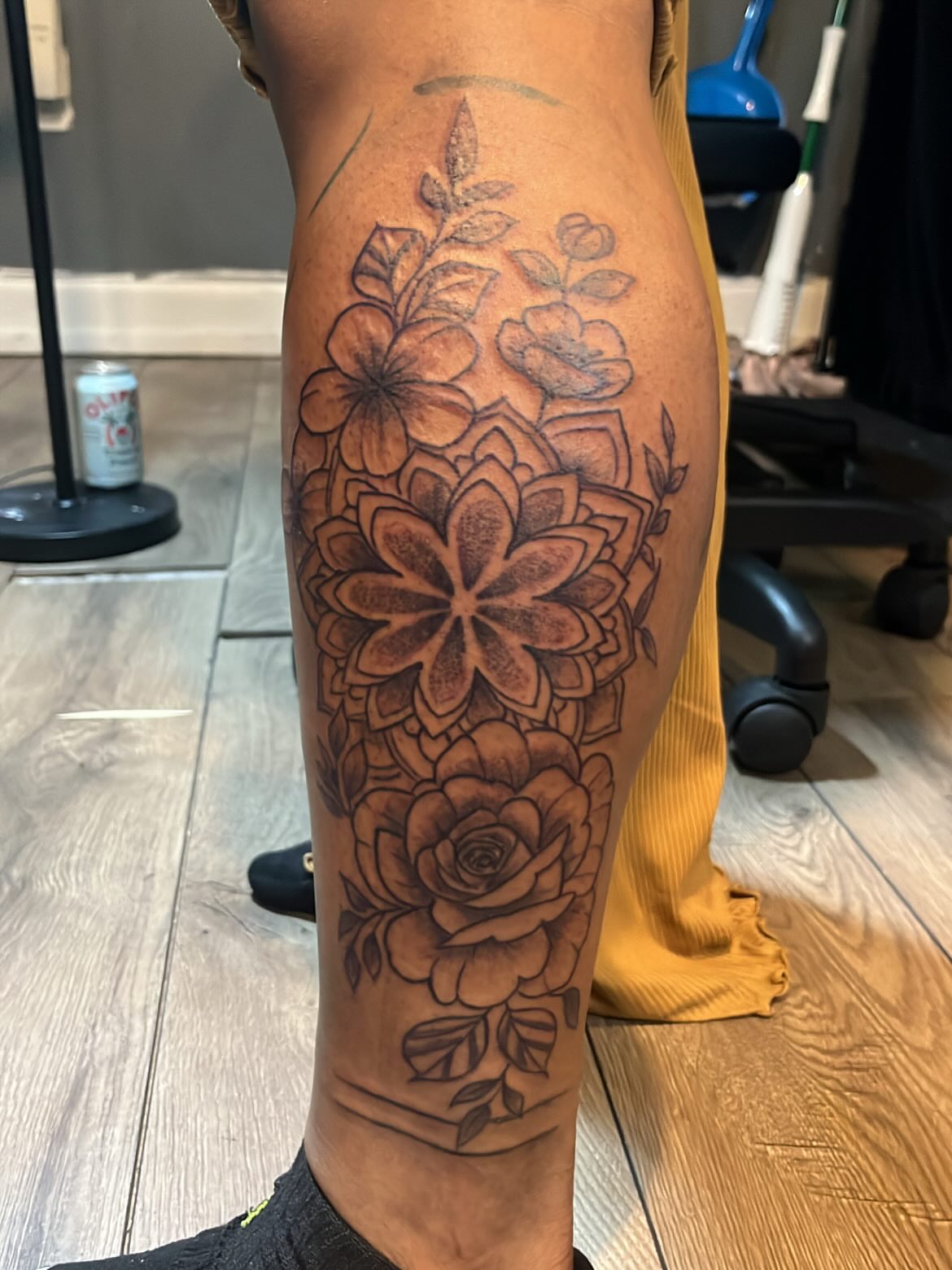Floral bouquet black and grey tattoo on the calf by SpicyMvstardInkk