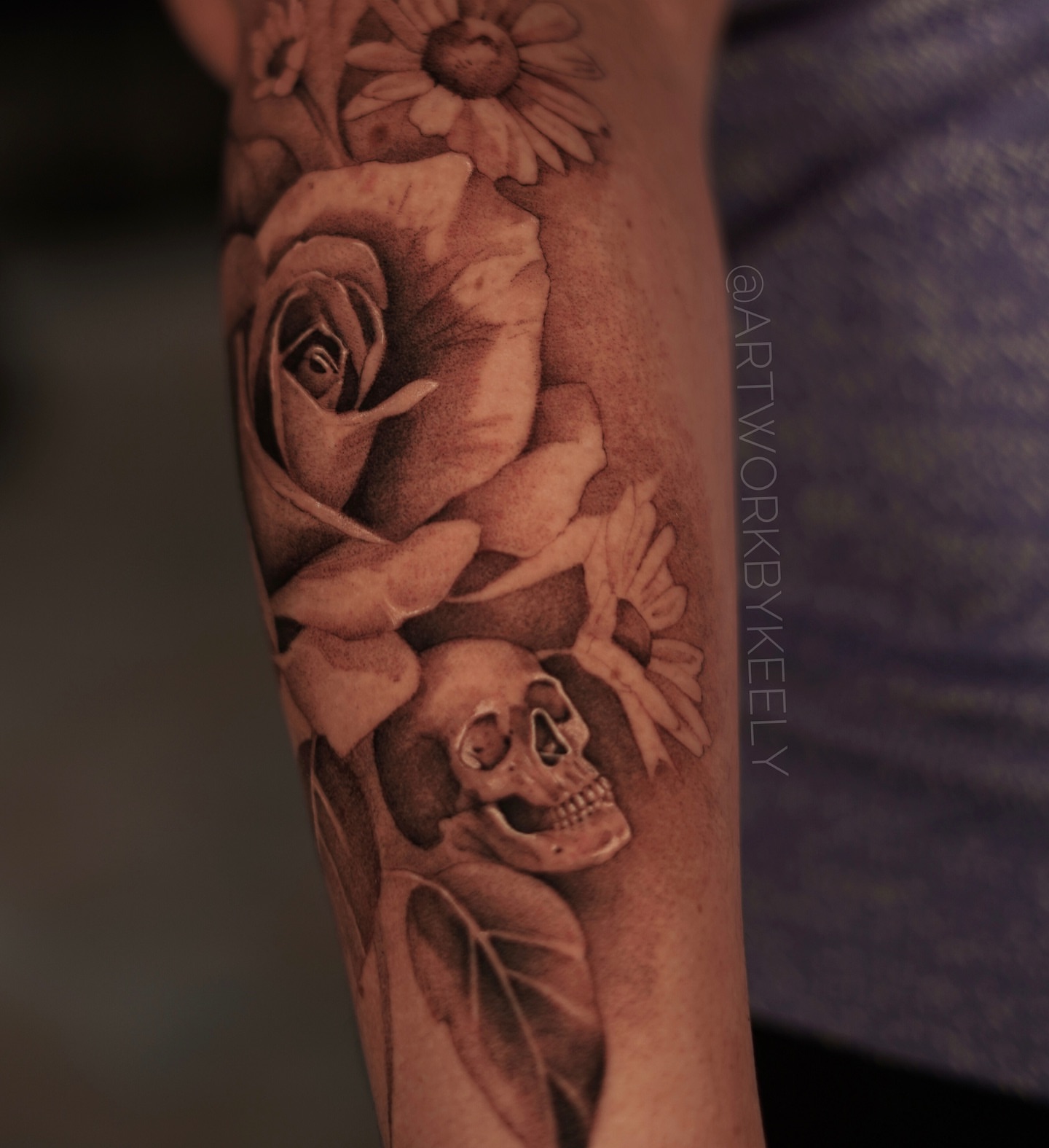Rose and skull realism tattoo on the forearm by Keely Thompson