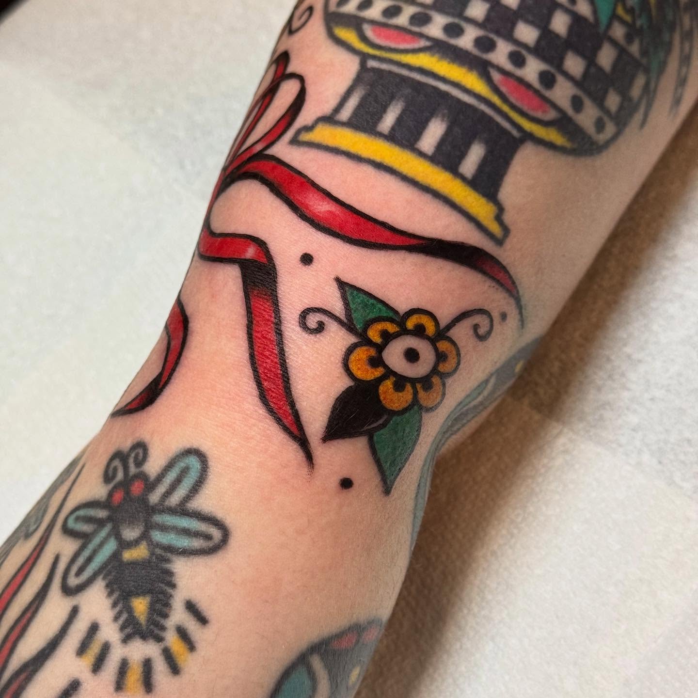 Flower and dagger American traditional tattoo on the forearm by JoJo Benton