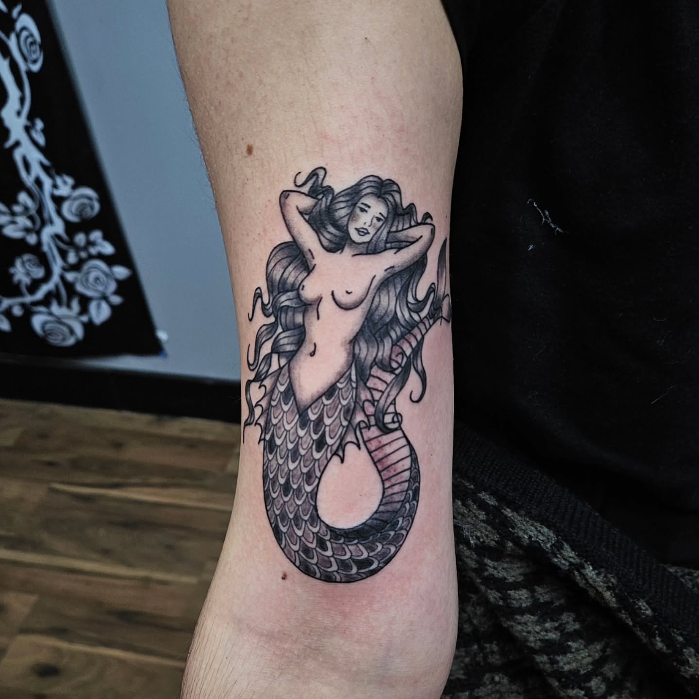 Mermaid black and grey tattoo on the forearm by Danny