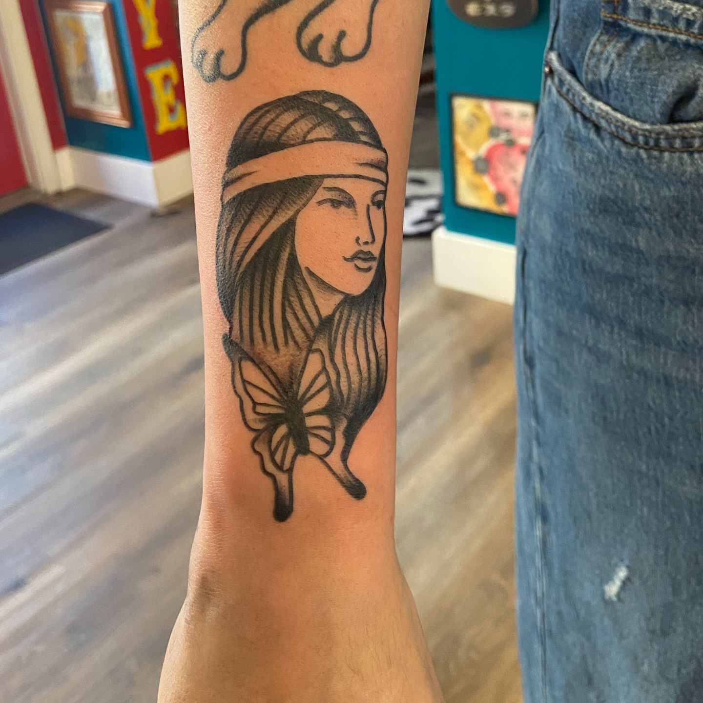 Indian woman black and grey tattoo on the forearm by Anthony Robles