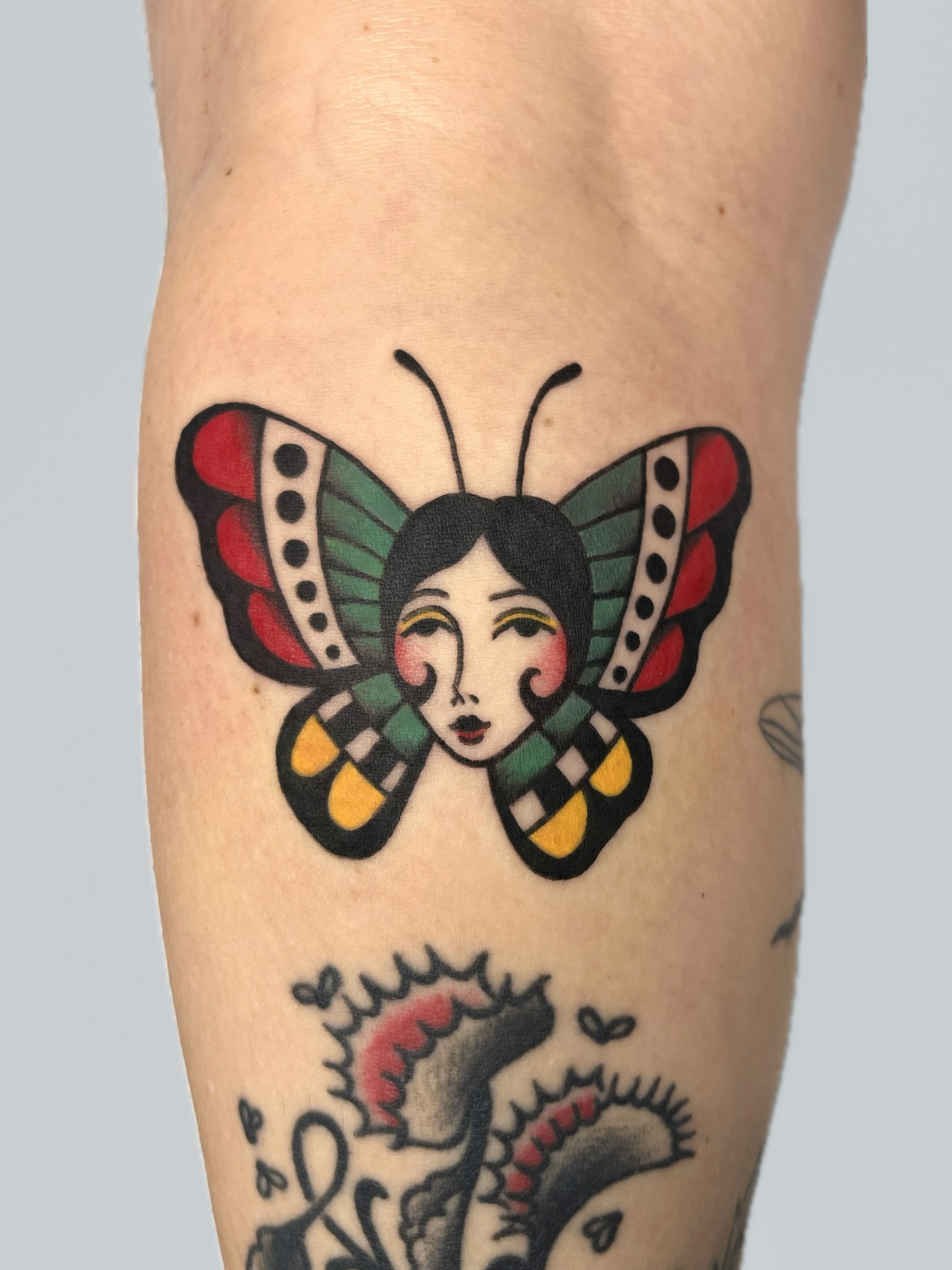 Butterfly American traditional tattoo on the forearm by nina