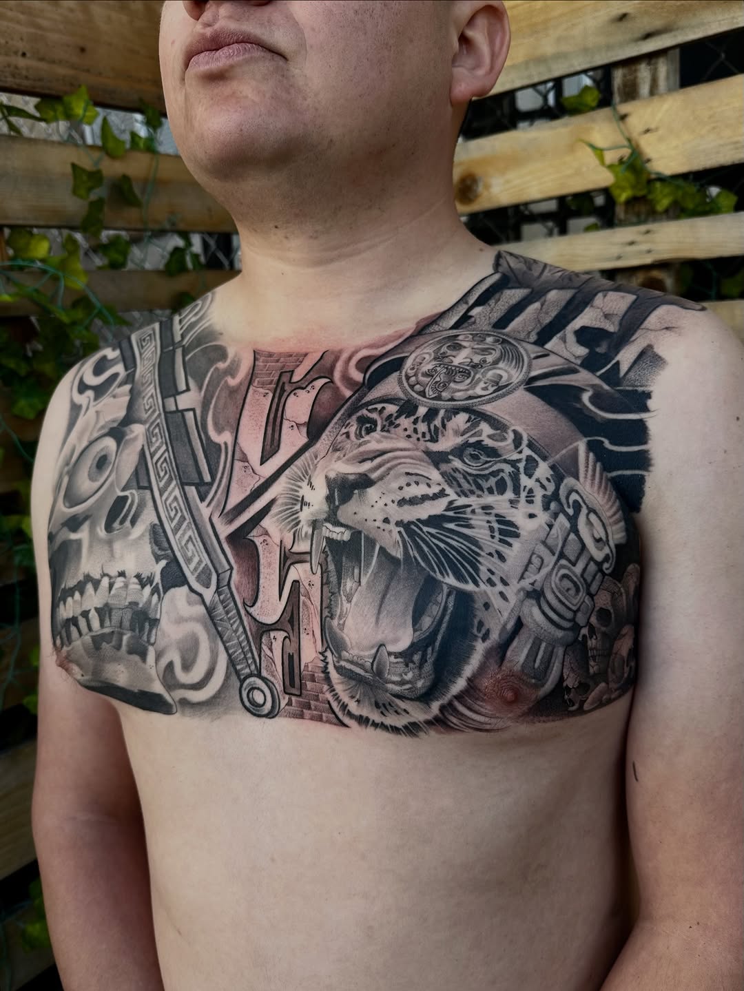 Jaguar and skull realism tattoo on the chest by San Diego Tattoo Artist