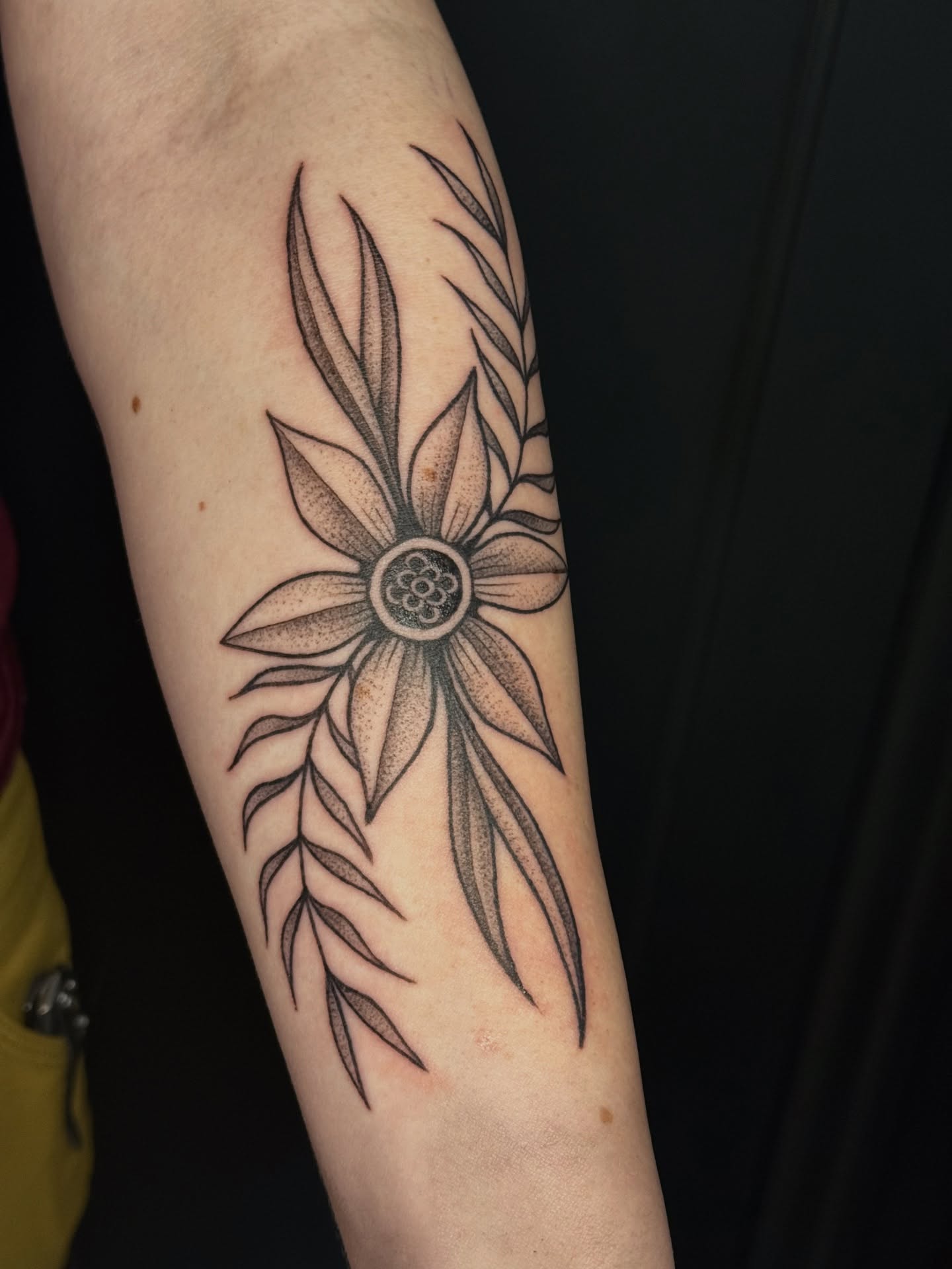 Flower dotwork tattoo on the forearm by Paul DeVay