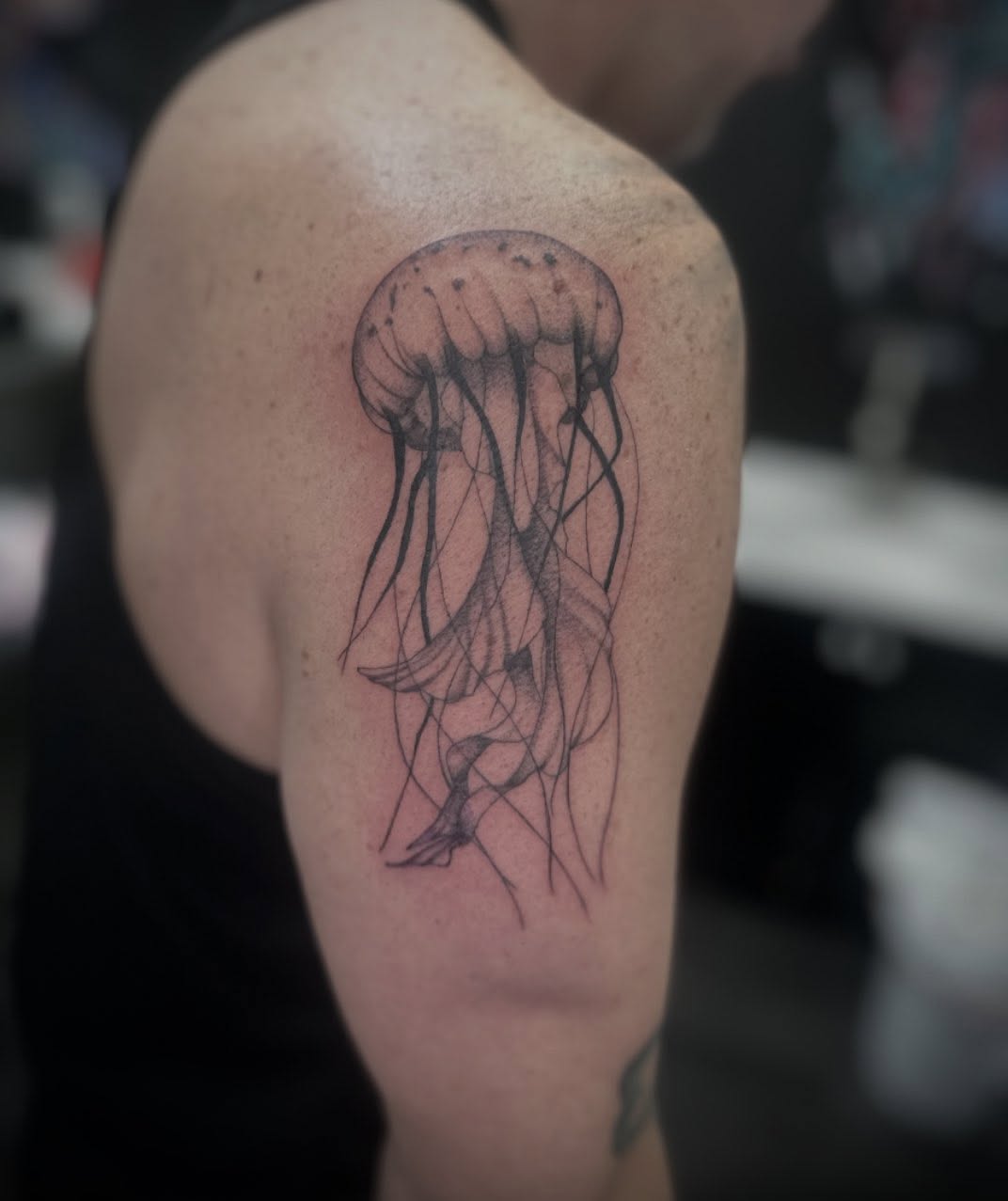 Jellyfish dotwork tattoo on the shoulder by Bell