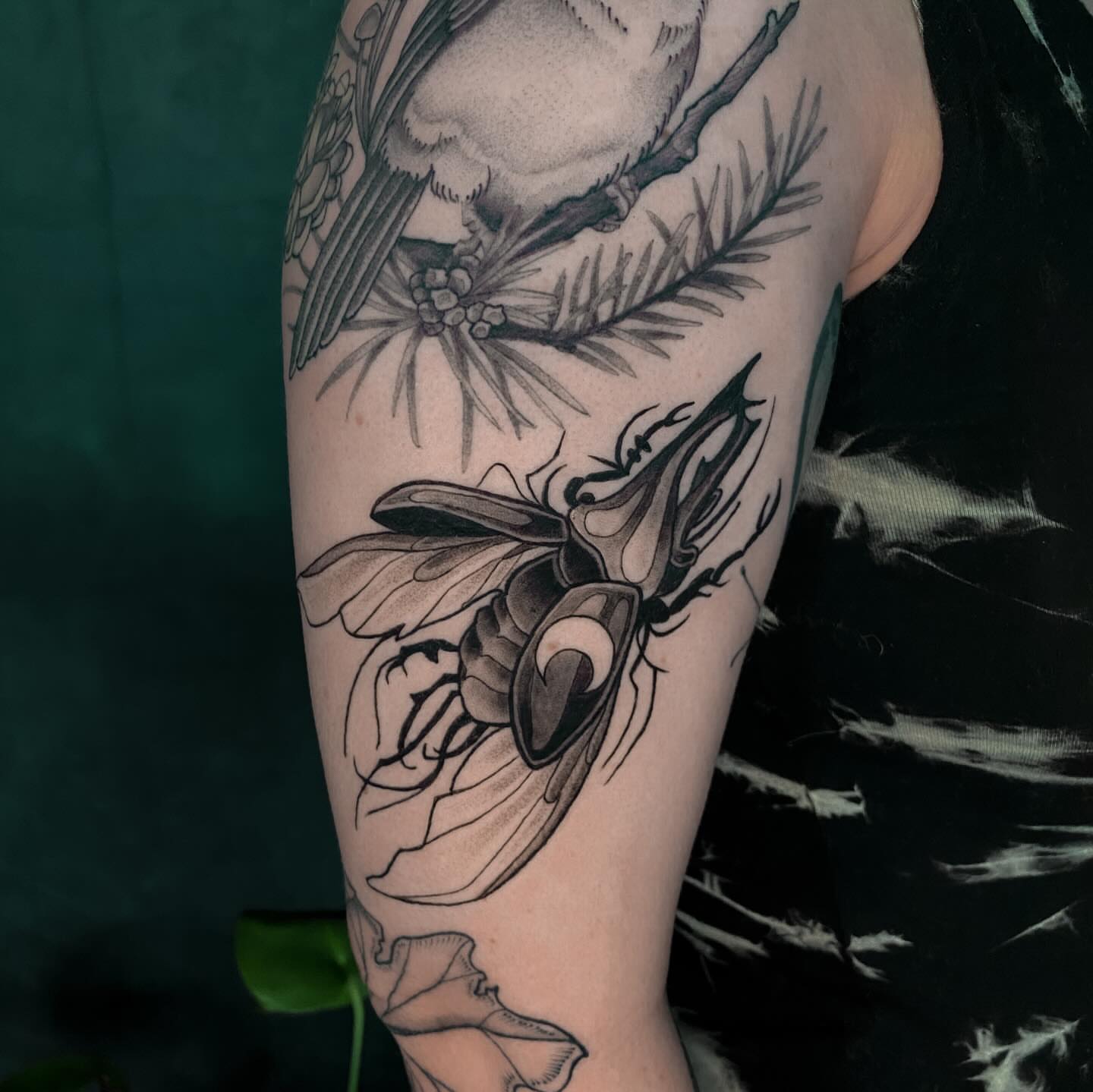Insect and floral realism tattoo on the forearm by ✥ G i t t a ✥