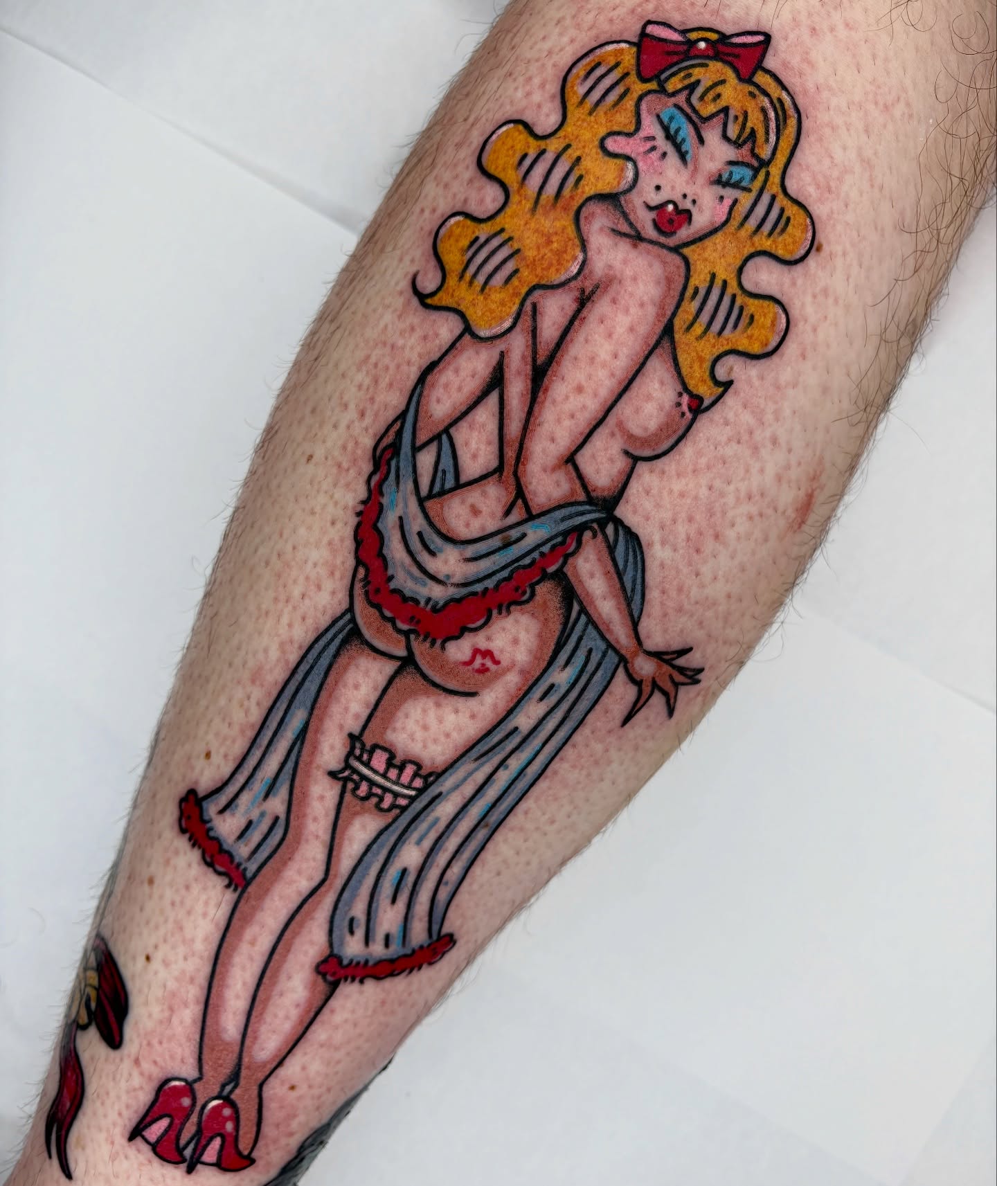 Female pin-up girl American traditional tattoo on the forearm by Bella