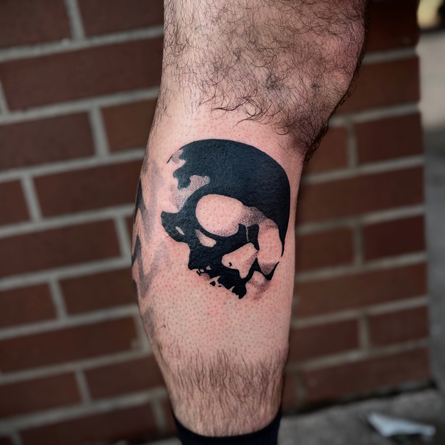 Skull dotwork tattoo on the forearm by Lauren Dempsey, Dearborn, Michigan