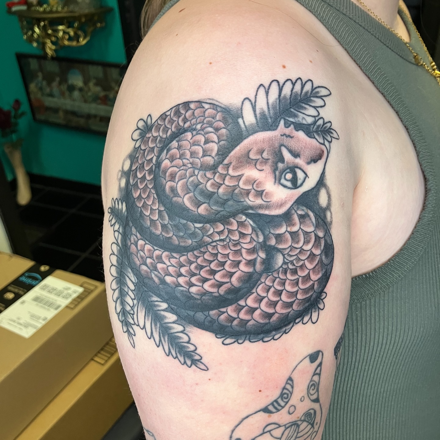 Snake with human head American traditional tattoo on the shoulder by maddie mcghee, Memphis, Tennessee