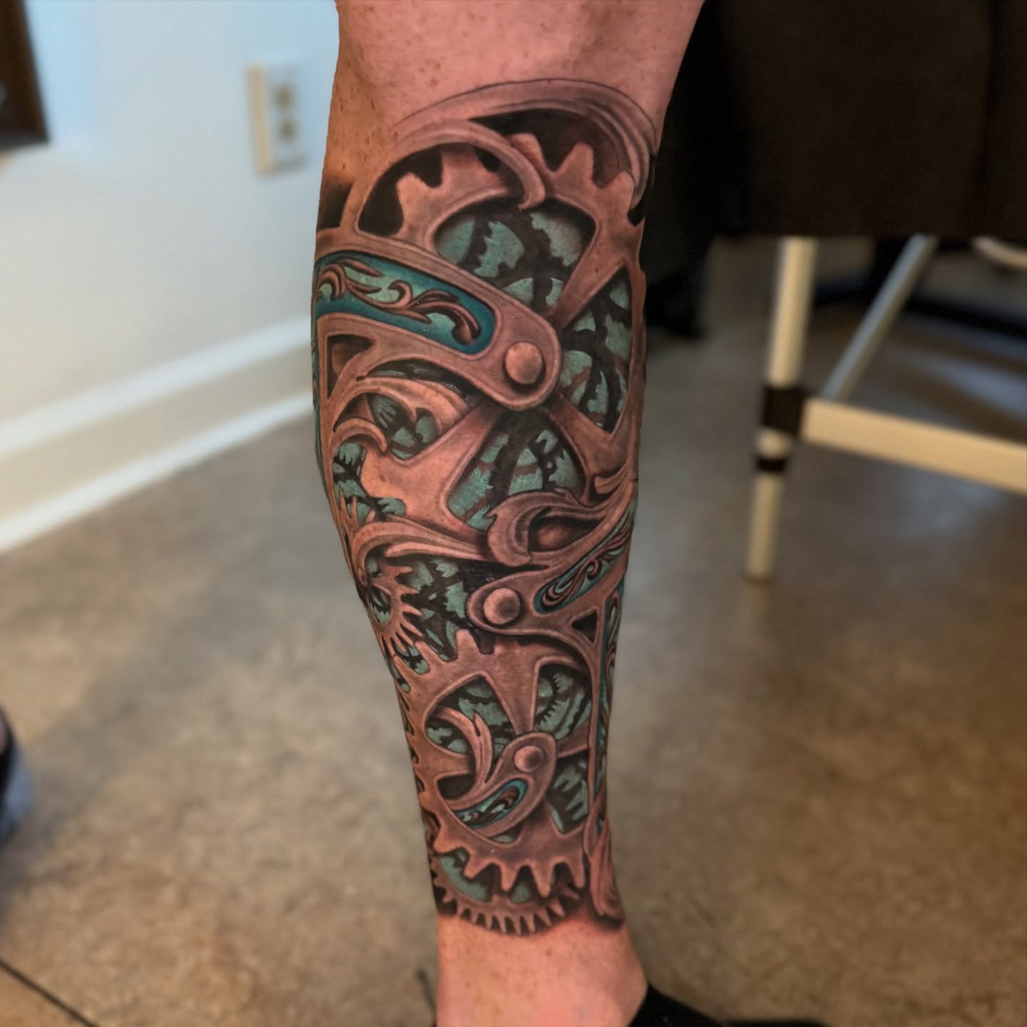 Mechanical gear geometric tattoo on the forearm by Matti Hixson