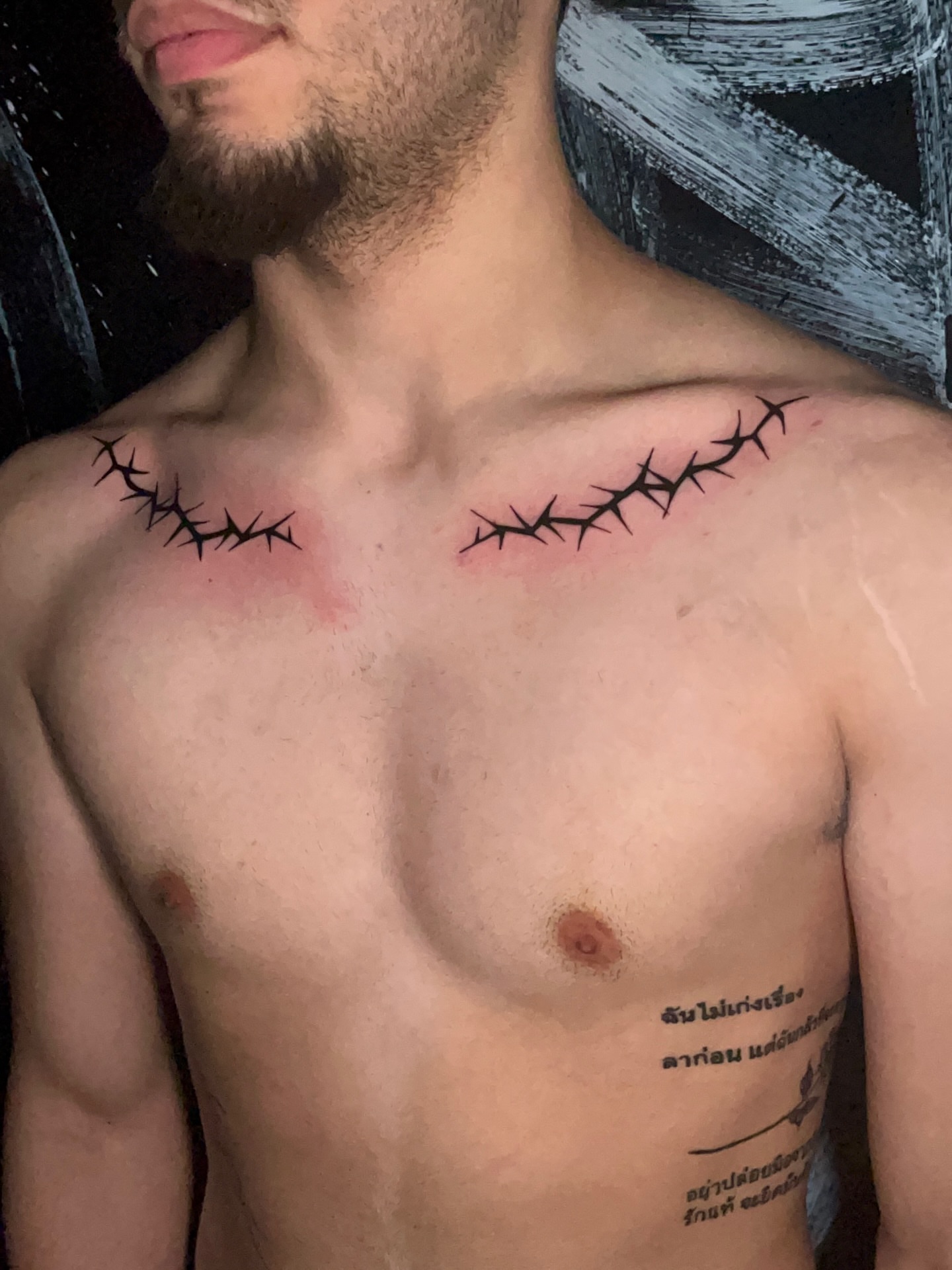 Thorn-like pattern black and grey tattoo on the chest by Ryan Hindenach