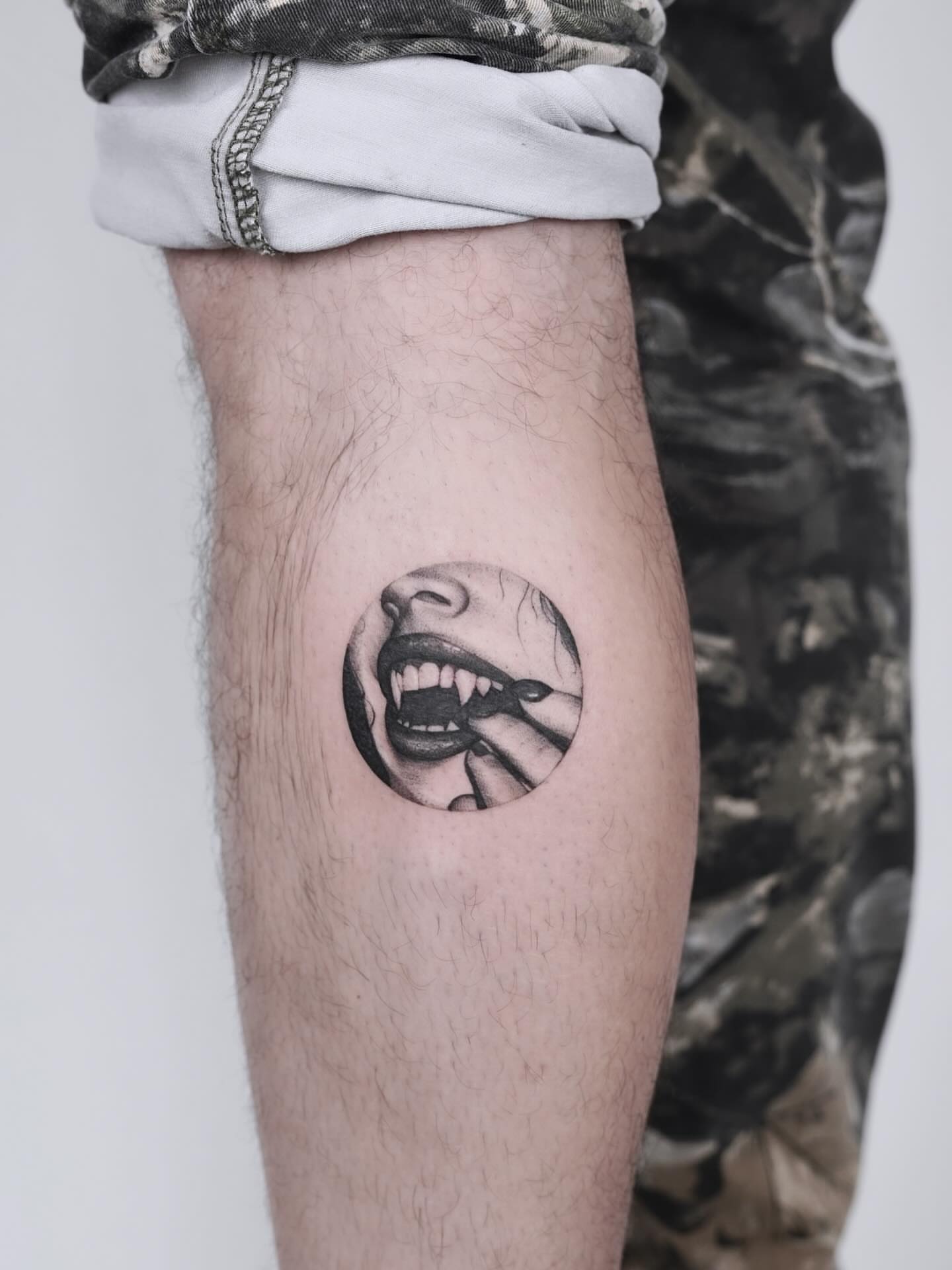 Fangs and mouth realism tattoo on the forearm by Julia