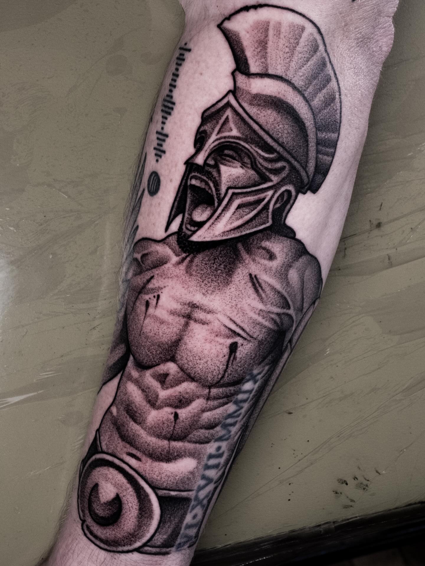 Muscular warrior dotwork tattoo on the forearm by Craig St Peter, Kansas City, Missouri