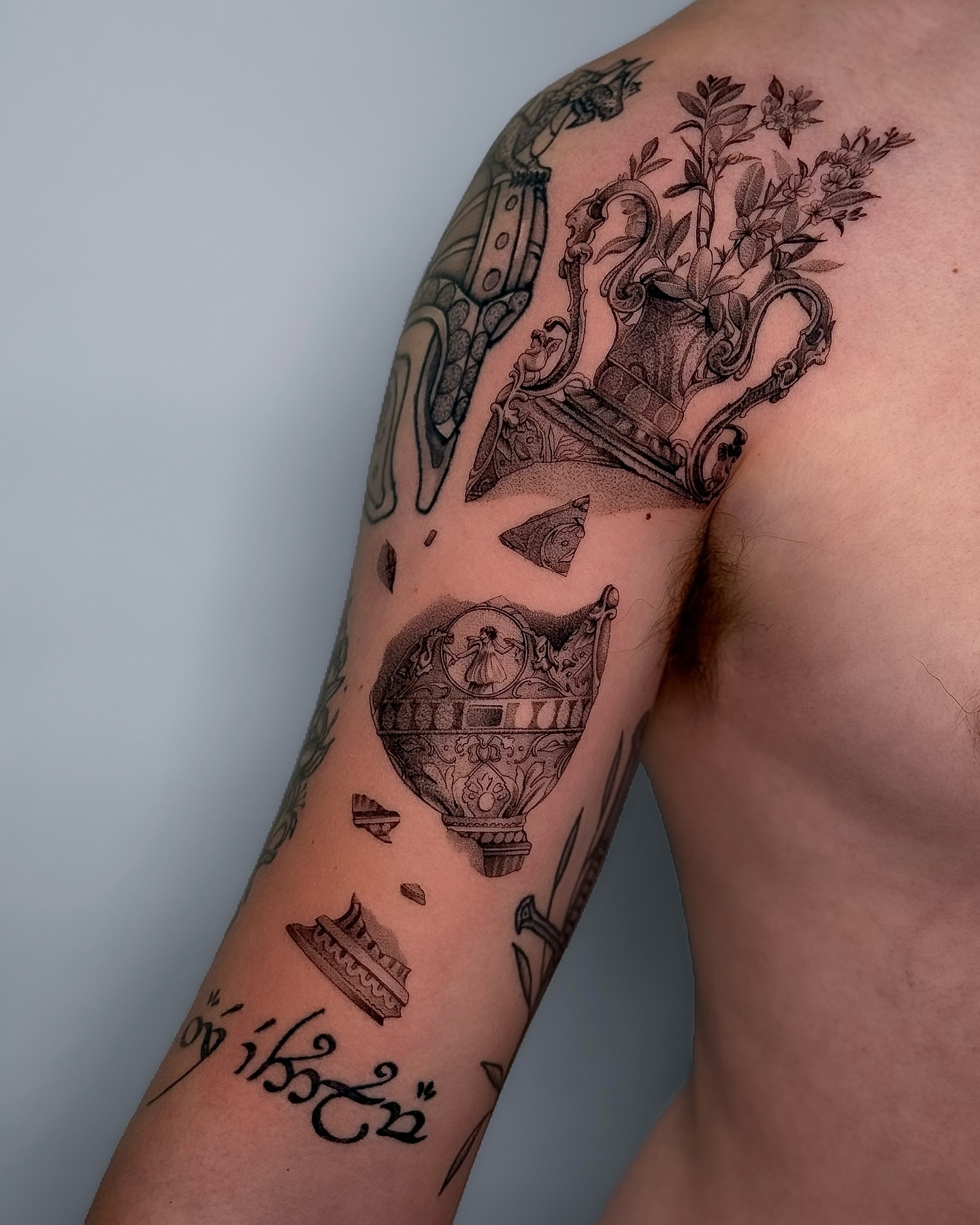 Vase with flowers black and grey tattoo on the upper arm by ♡ 𝕍𝕚𝕔𝕥𝕠𝕣𝕚𝕒 ℍ𝕠𝕝𝕞𝕖𝕤 ♡, Avon, Ohio