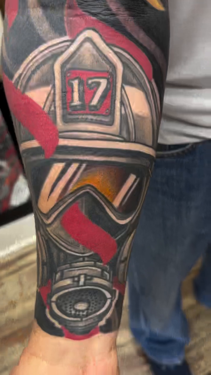 Firefighter helmet and alligator realism tattoo by Jeremy Justice, New Orleans, Louisiana
