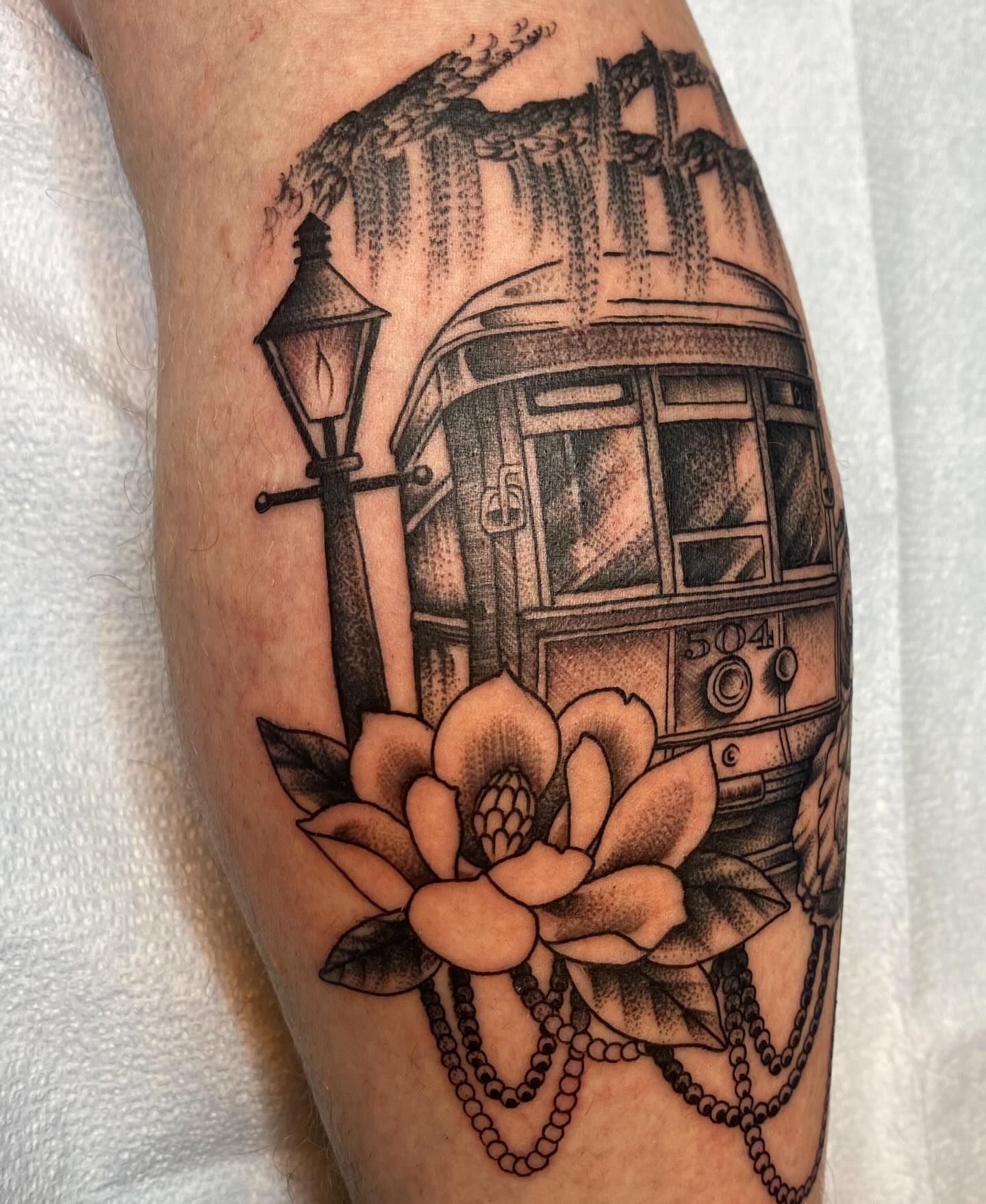 Streetcar and magnolia realism tattoo on the forearm by Vivian HavaTattoo, Richmond, Virginia