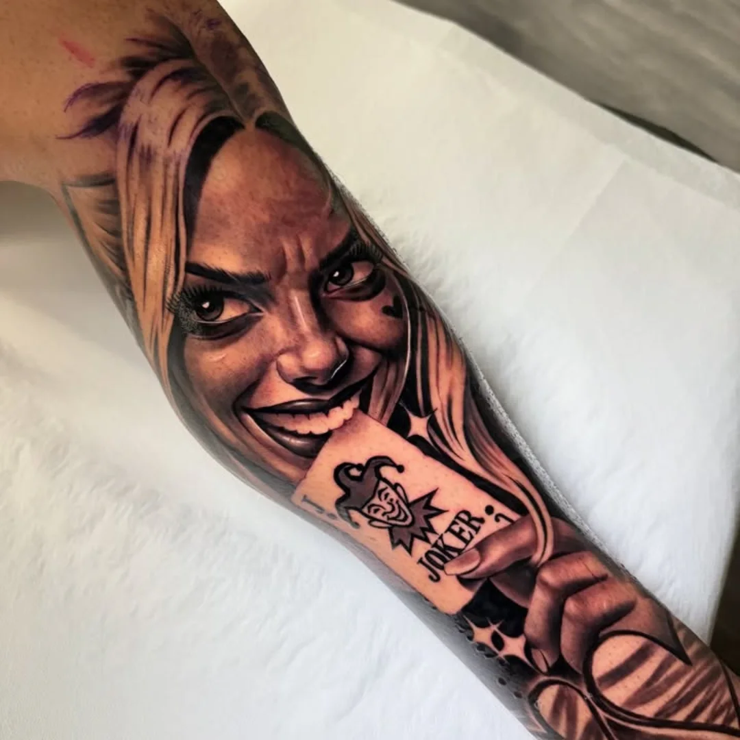 Joker character realism tattoo on the forearm by ink.alchemist
