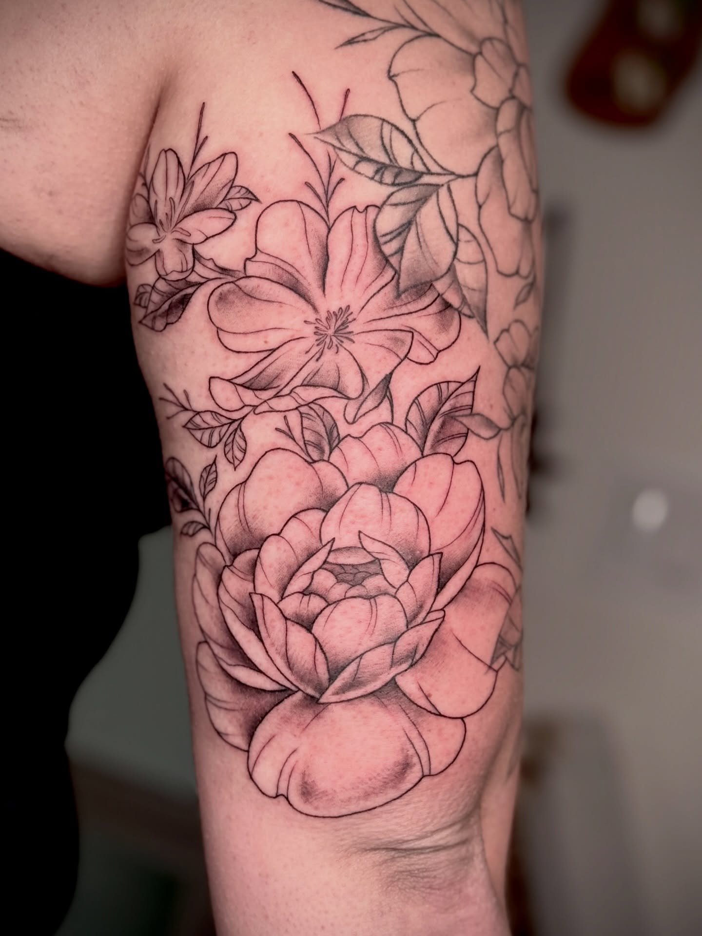 Floral bouquet realism tattoo on the forearm by Tattoo & Body Artist, Gastonia, North Carolina