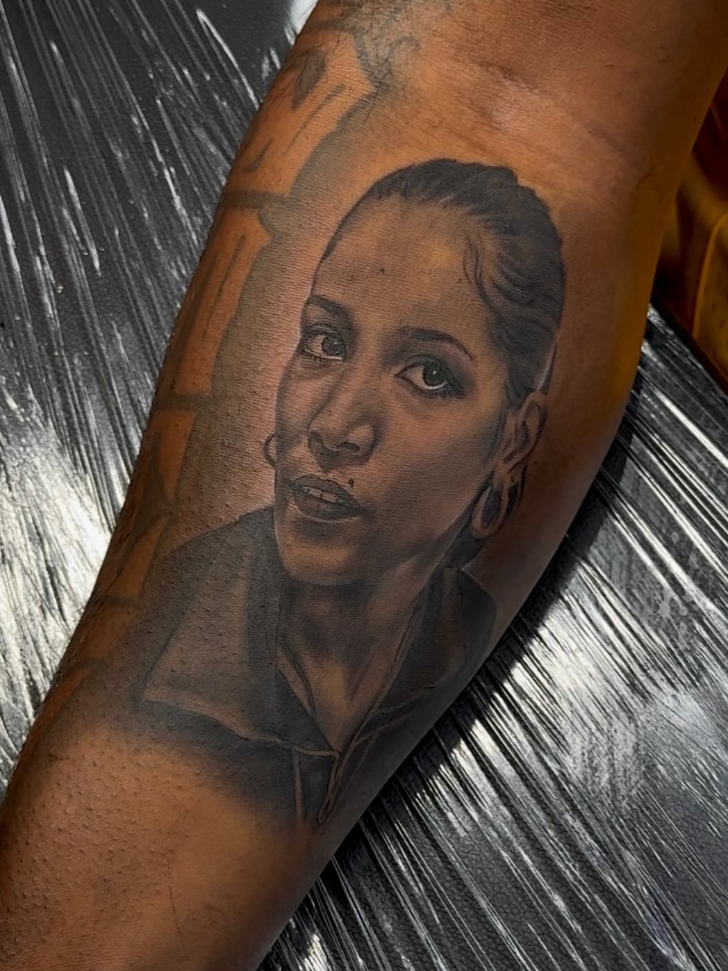 Portrait realism tattoo on the forearm by Tatt2T (T King)