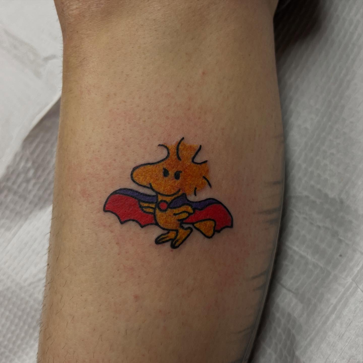 Chicken superhero new school tattoo on the forearm by doodle