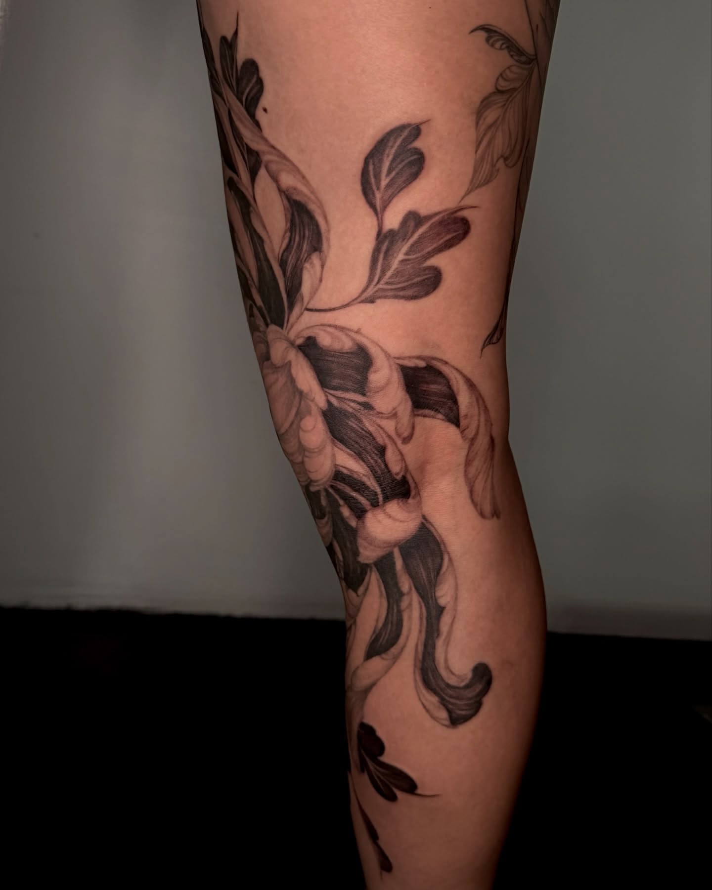 Floral arrangement black and grey tattoo on the forearm by Sab