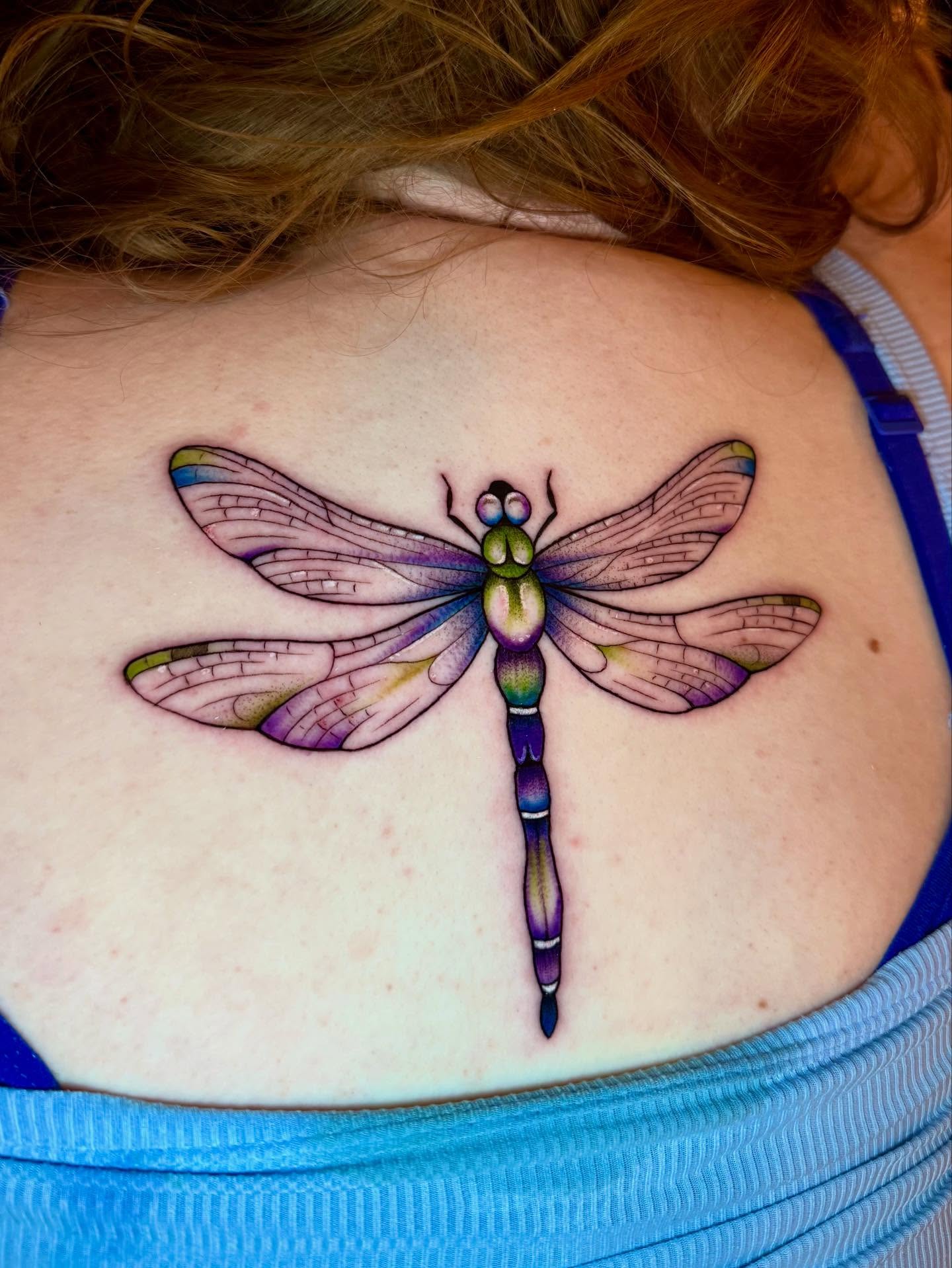 Dragonfly realism tattoo on the back by Morgan Peeples