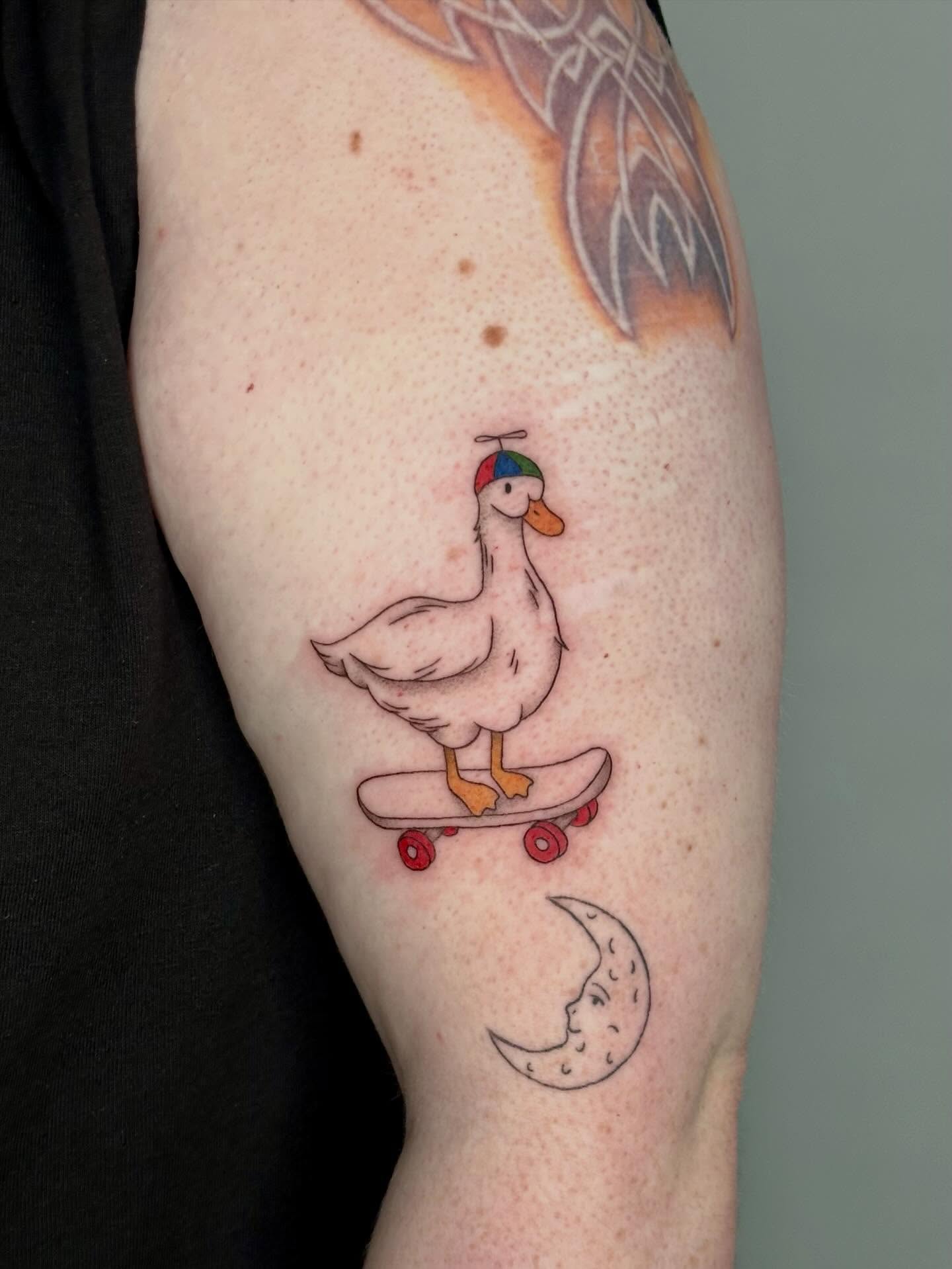 Goose on skateboard illustrative tattoo on the forearm by 🌼Kristen Kooster Tattoos🌼