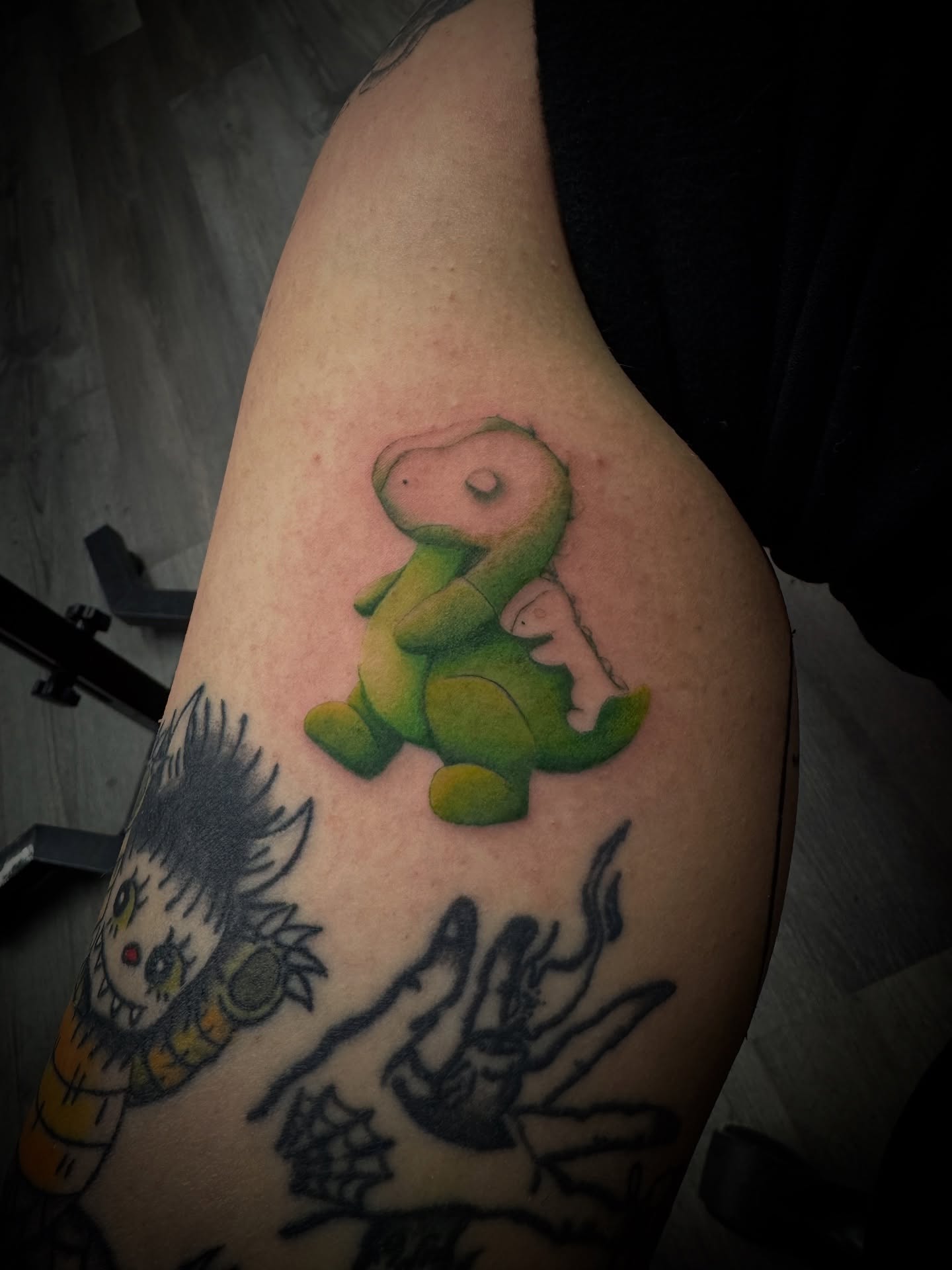 Baby dinosaur American traditional tattoo on the thigh by Gianna G
