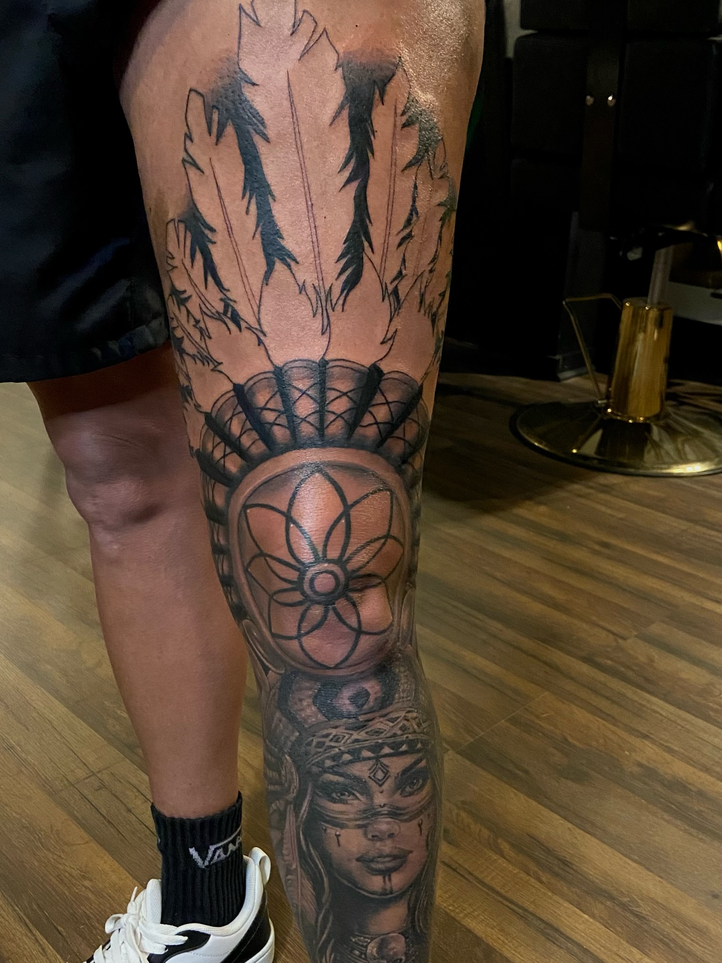 Indigenous woman geometric tattoo on the calf by Colt