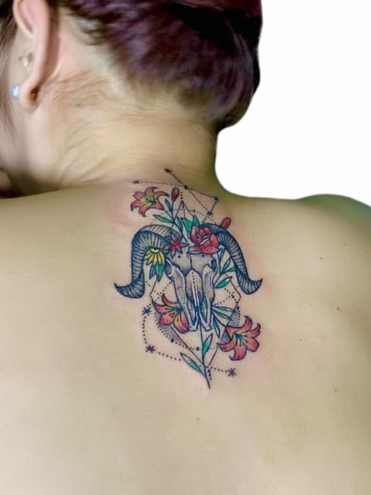 Ram horns and flowers geometric tattoo on the back by Gerd thINK_TATTOO