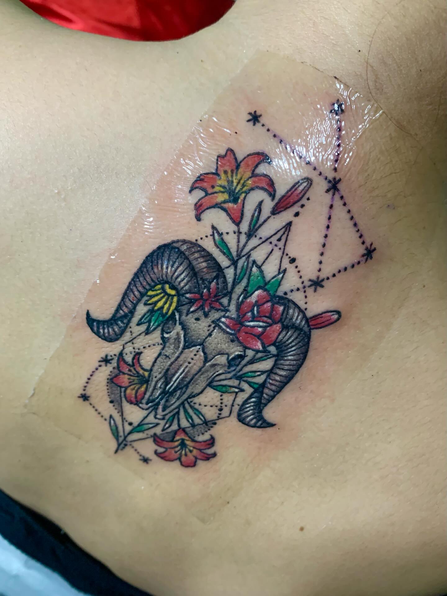 Ram and flowers American traditional tattoo on the chest by Gerd thINK_TATTOO