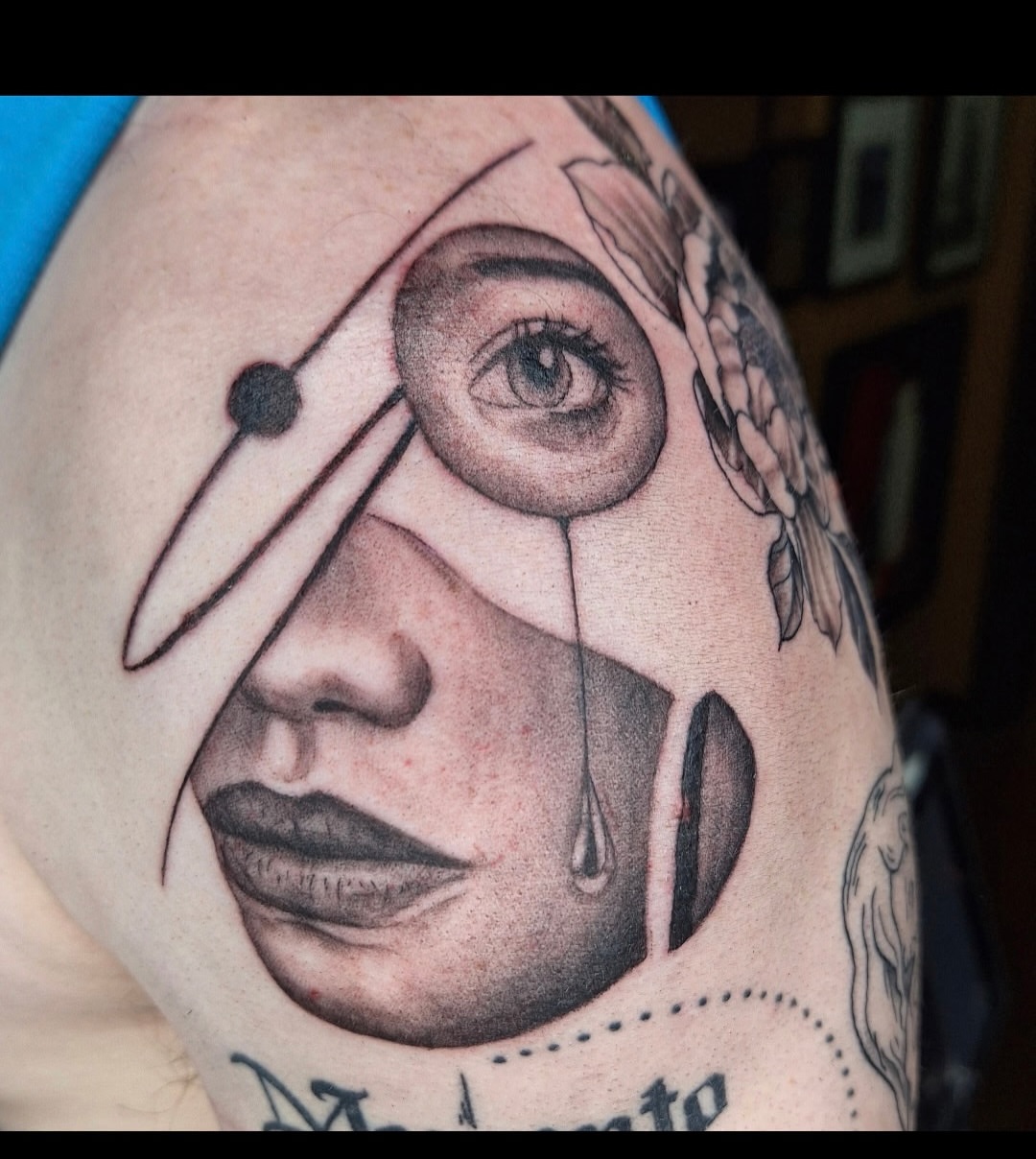 Abstract face dotwork tattoo on the shoulder by Chris Bell