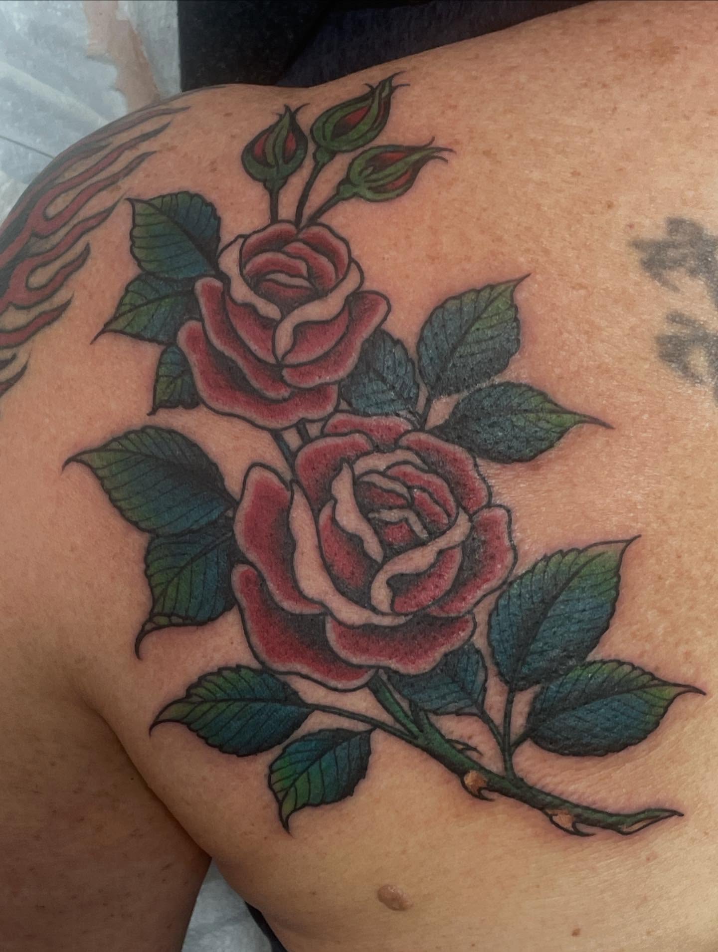 Roses American traditional tattoo on the shoulder by Haley McMahon
