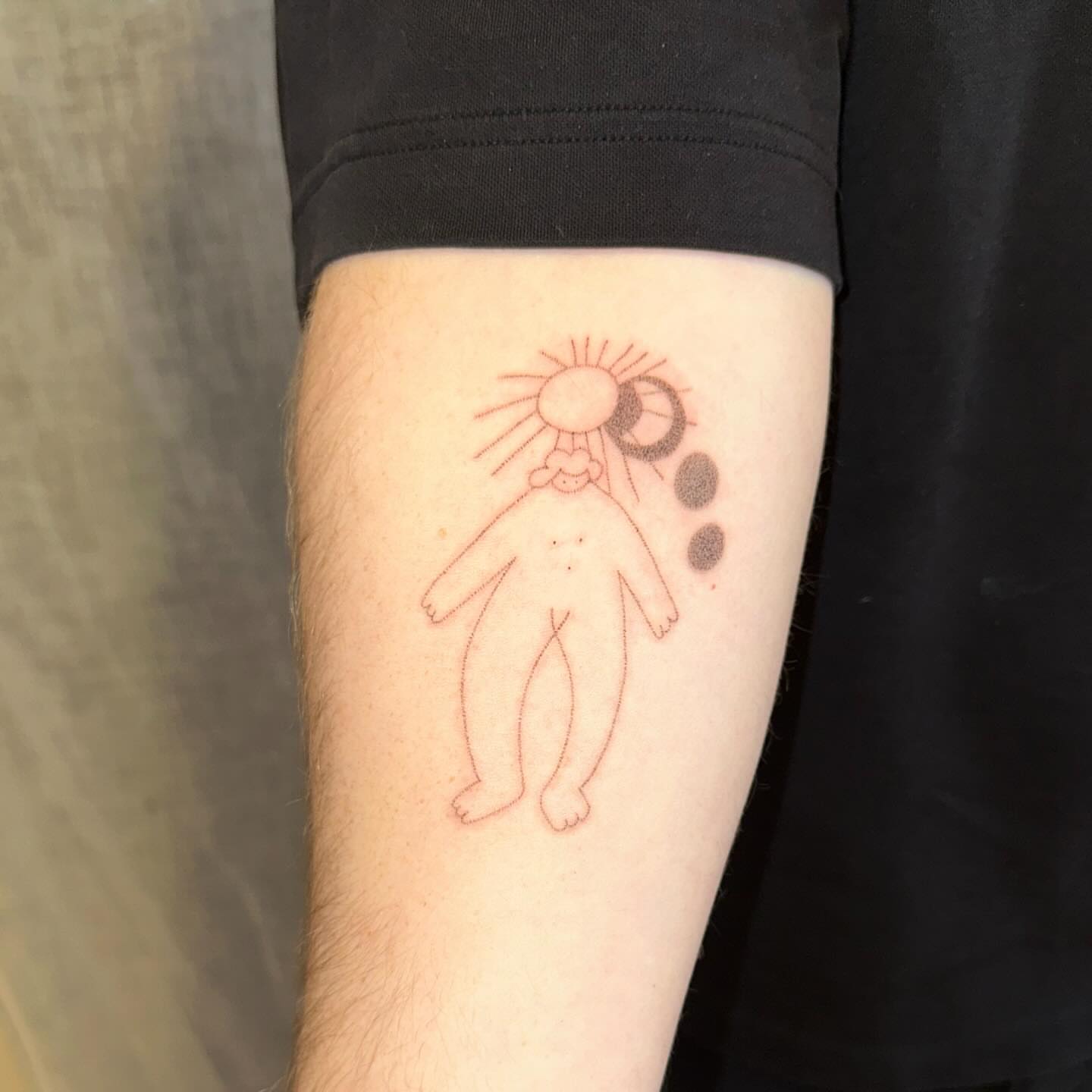 Abstract figure minimalist tattoo on the forearm by kate