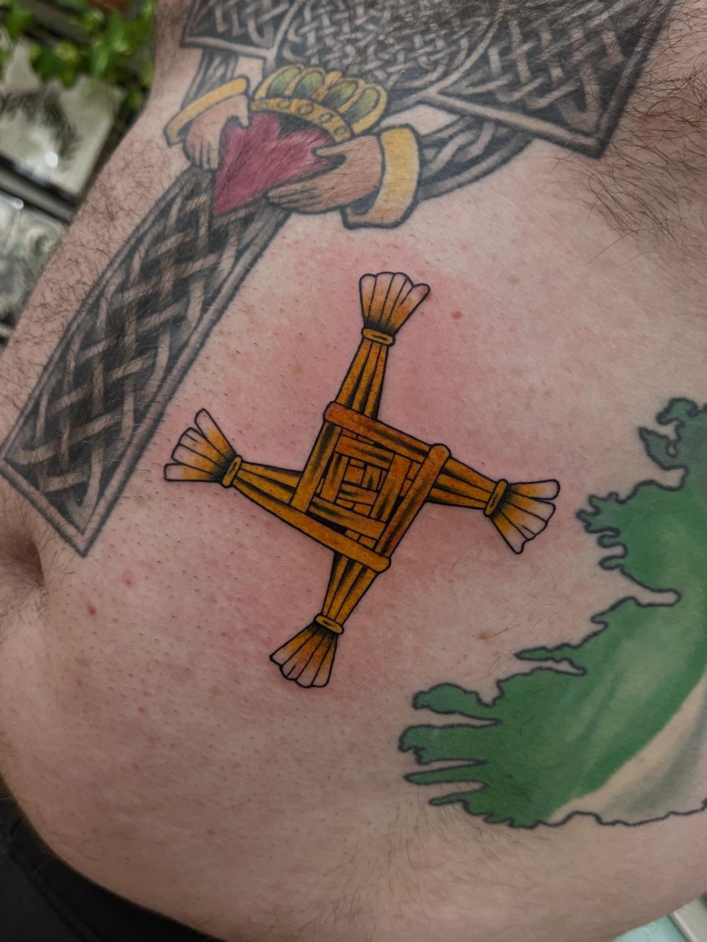 St. patrick's day cross American traditional tattoo on the torso by Matt Kearney