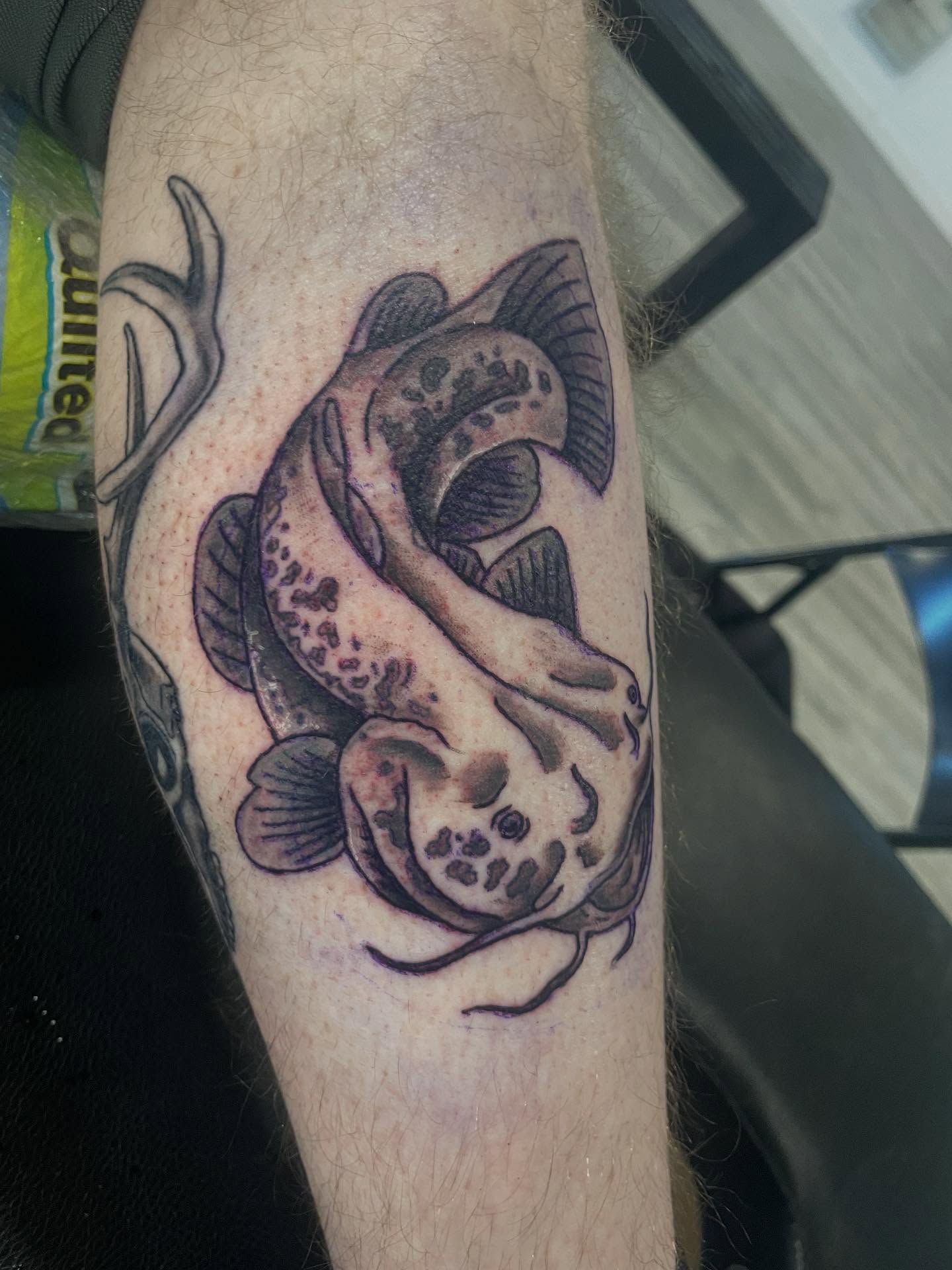 Fish black and grey tattoo on the forearm by Logan Casimir