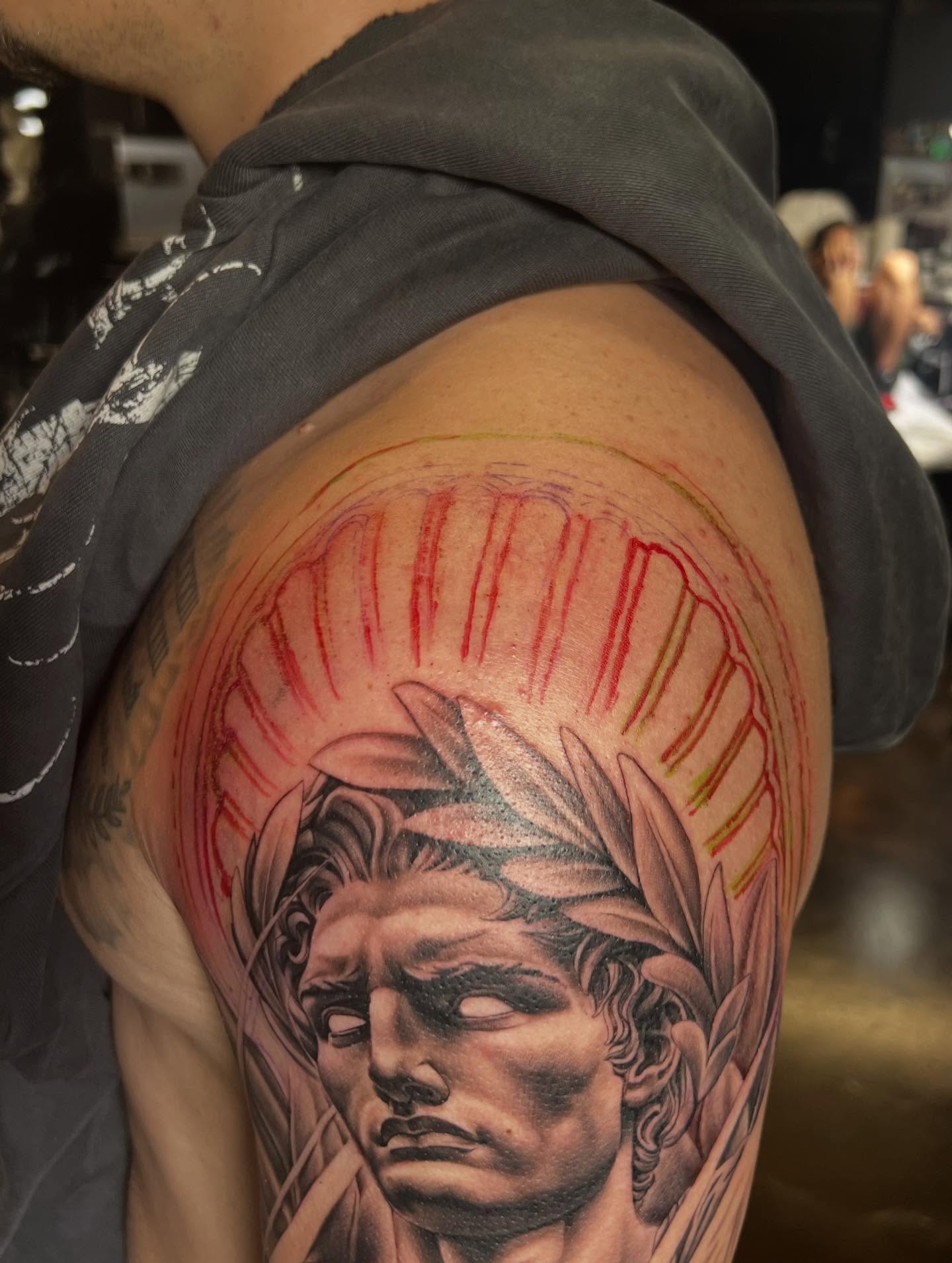 Statue head realism tattoo on the shoulder by CRISTIAN AMORES シ