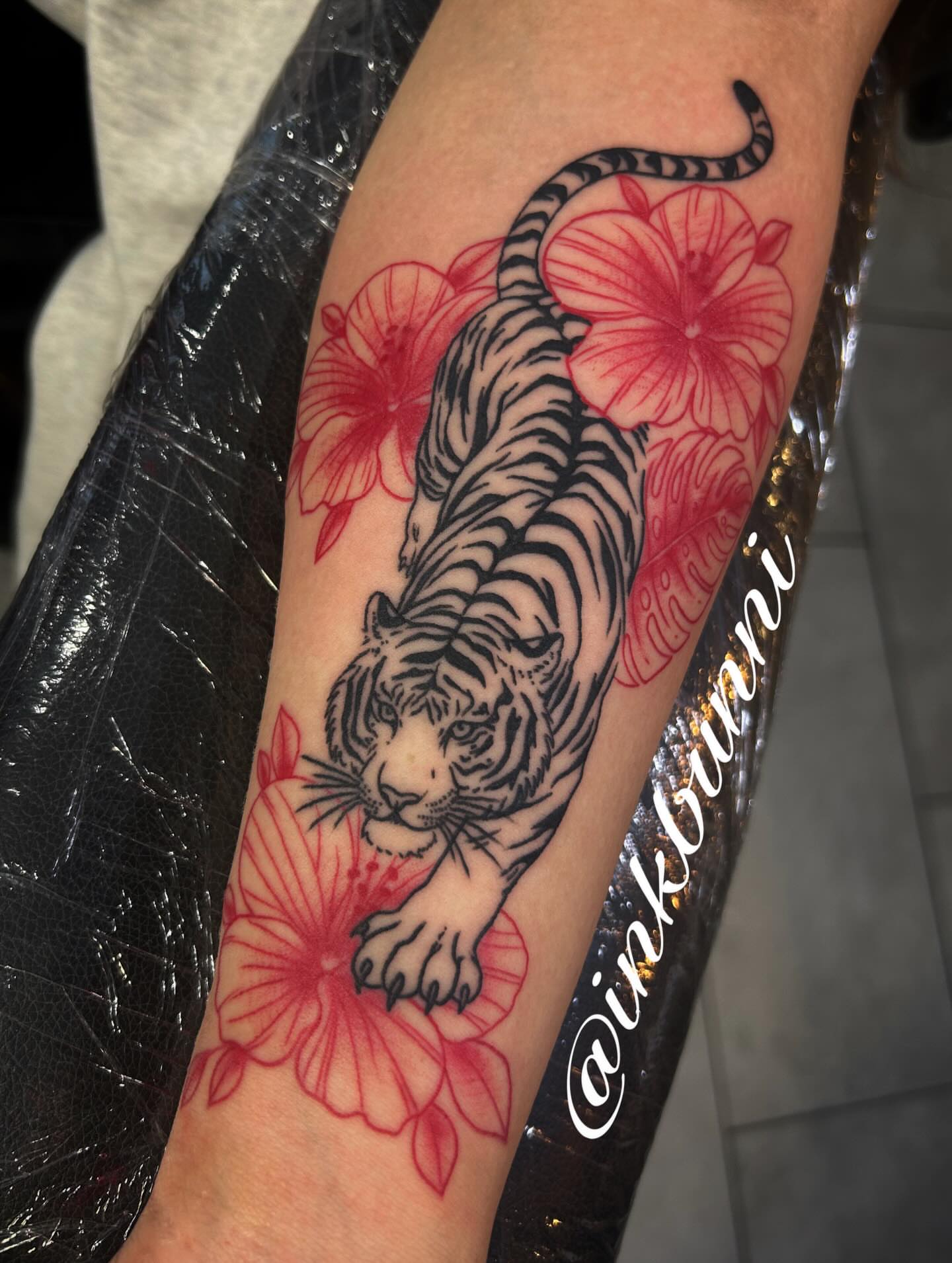 Tiger and flowers japanese irezumi tattoo on the forearm by Hailey Aka inkbunni, Detroit, Michigan