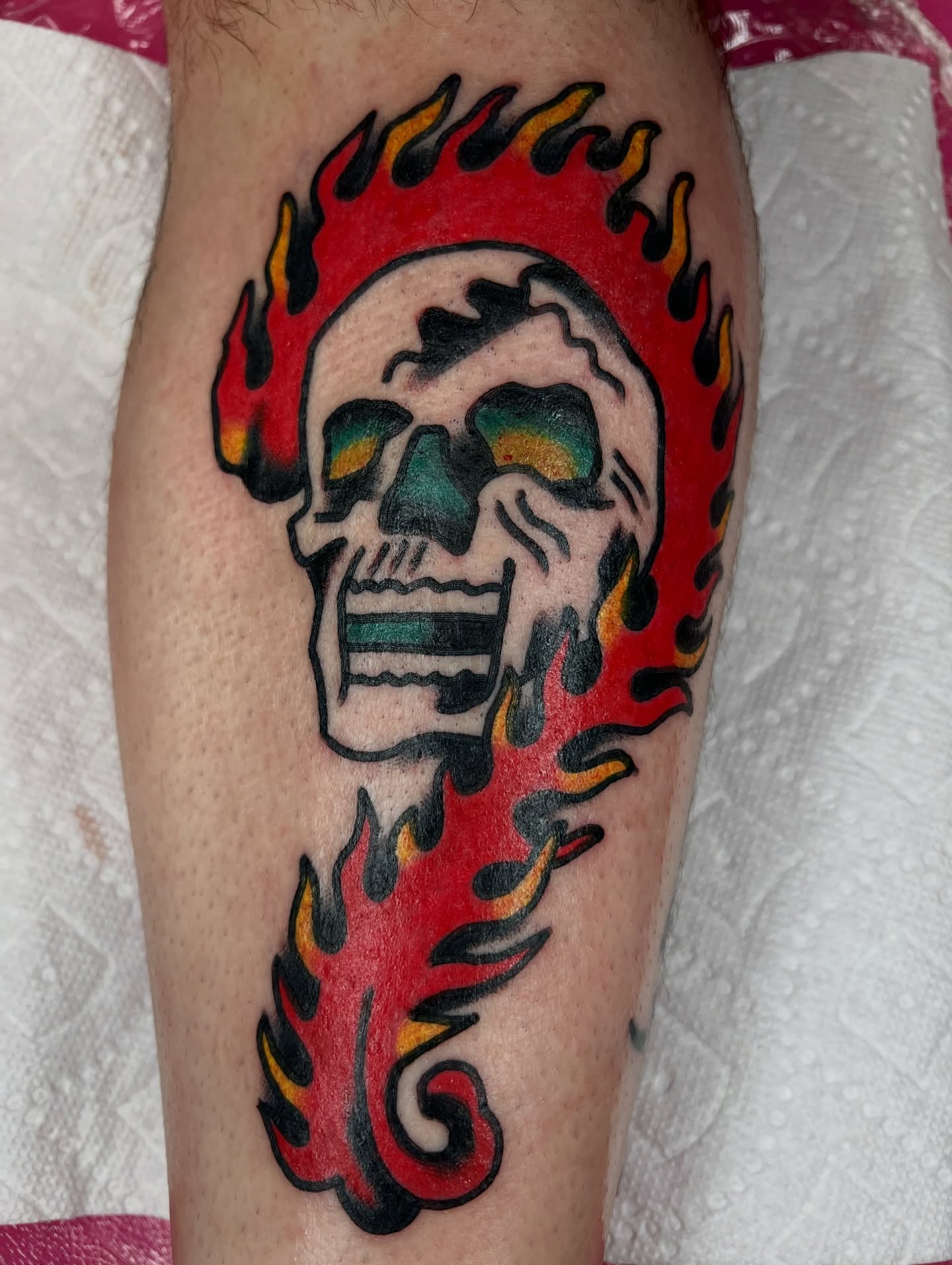 Flaming skull American traditional tattoo on the forearm by Like A Horse Corral